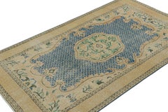 Vintage Turkish Rug with Gold Medallion and Blue Open field, from Rug & Kilim