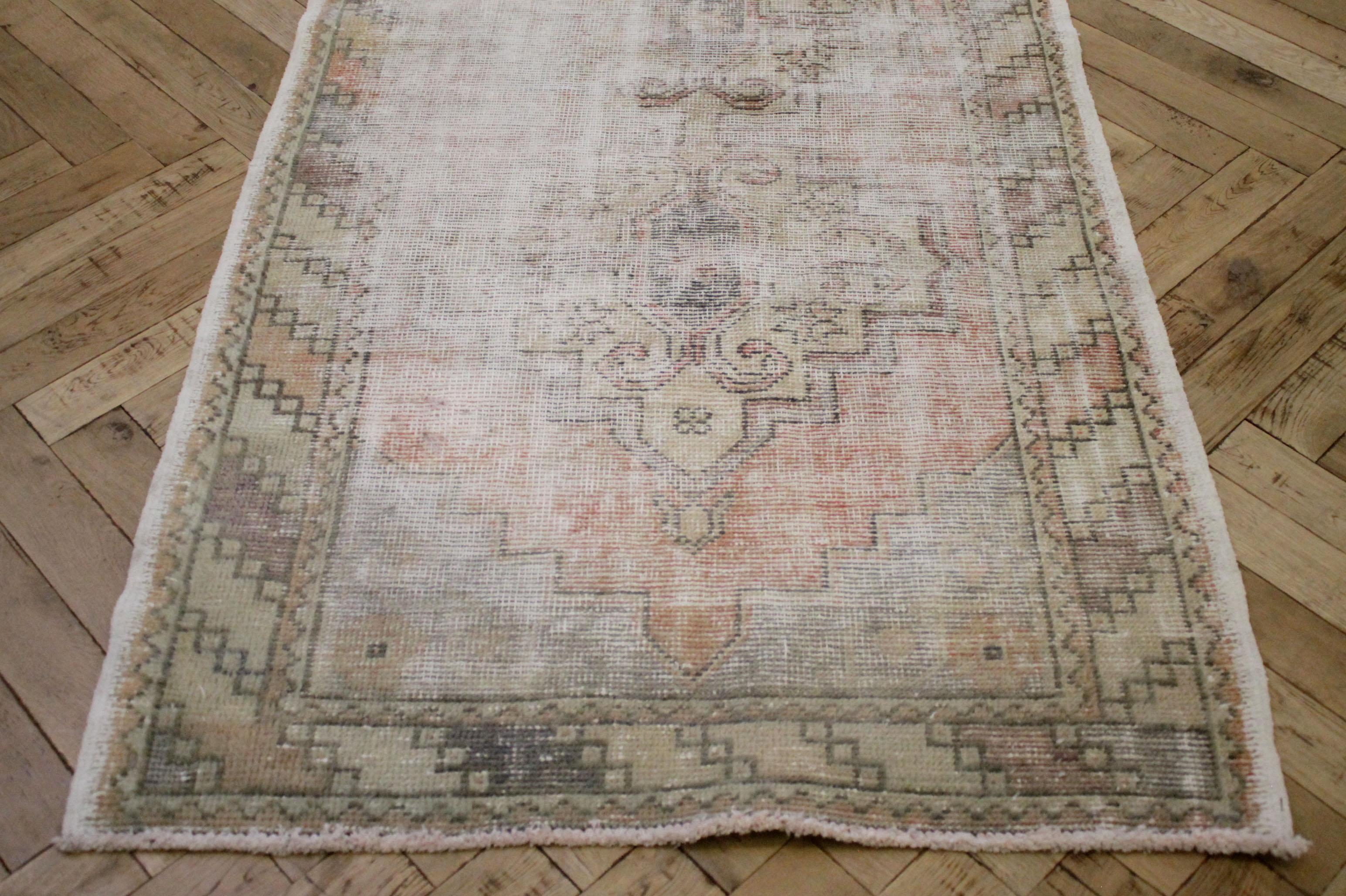 Vintage Turkish Malaya runner rug. The warm shades of red and pops of blue as well as intricate patterns not only adds character but also makes it truly one-of-a-kind. Some pattern and color variation and fading, with vintage items is normal.