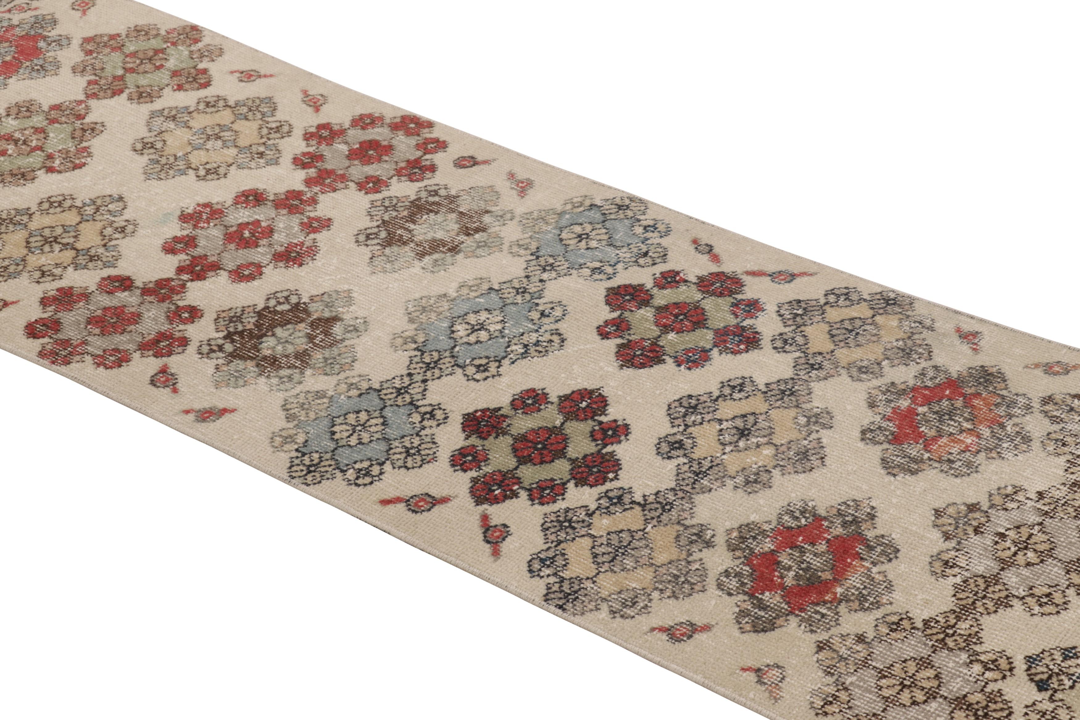 Hand knotted in wool and originating in Turkey circa 1950-60, this 2x7 vintage runner rug is an exciting new curation from Rug & Kilim’s collection of one-of-a-kind mid-century Turkish pieces. 

On the Design:

A beige-cream field underscores