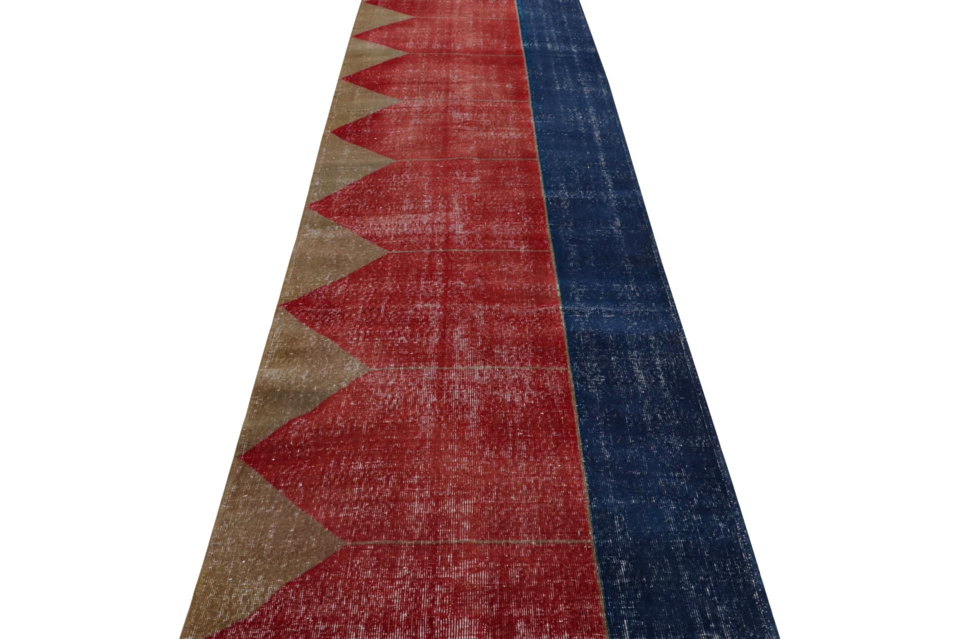 Hand-Knotted  Vintage Turkish runner rug in Red, Blue and Brown Patterns by Rug & Kilim For Sale