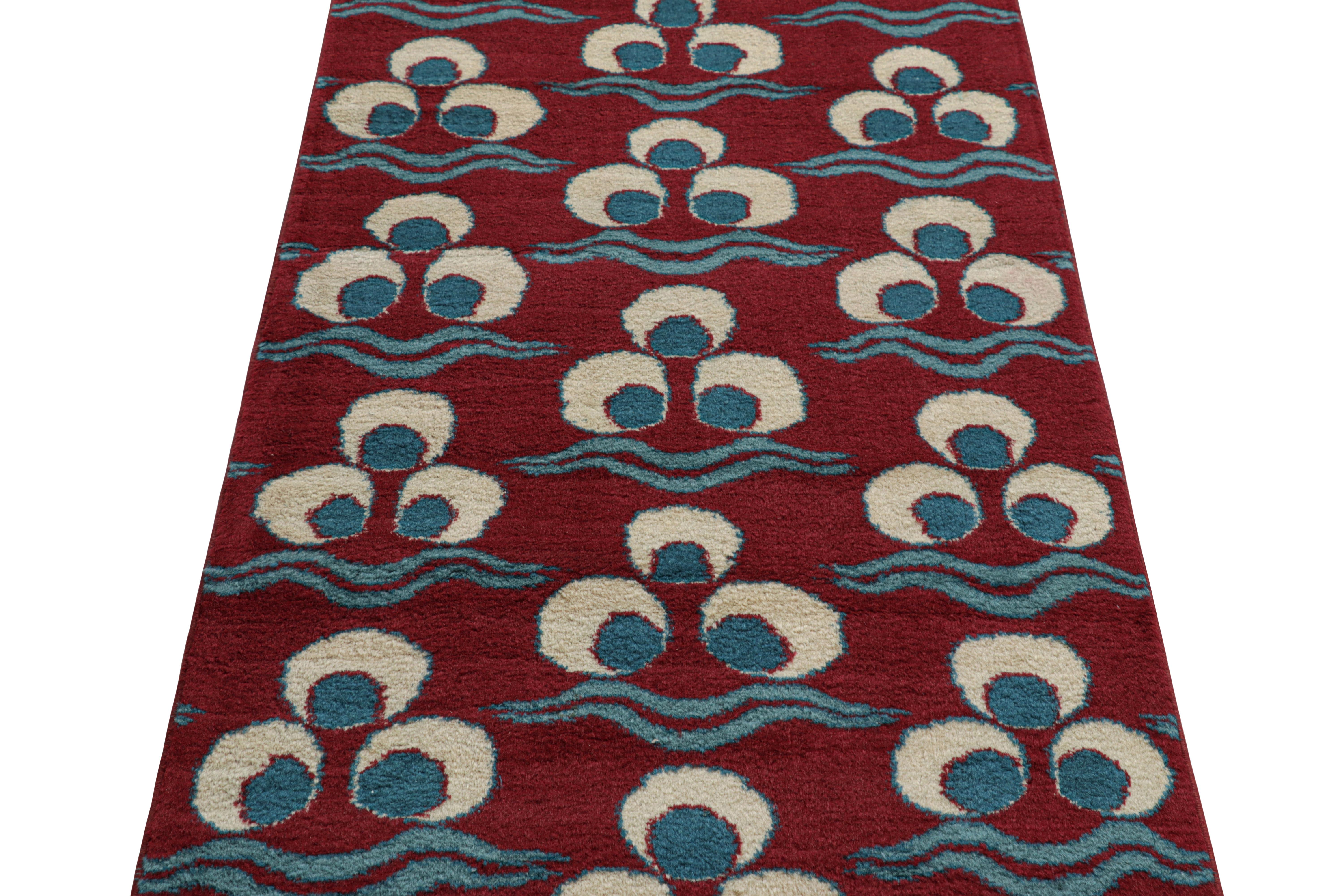Hand-knotted in wool circa 1950-1960, this 3x12 vintage runner rug from Turkey is a very special piece, featuring a rich mid-century interpretation of the classical chintamani design. 

On The Design:

This vintage Turkish rug features a burgundy