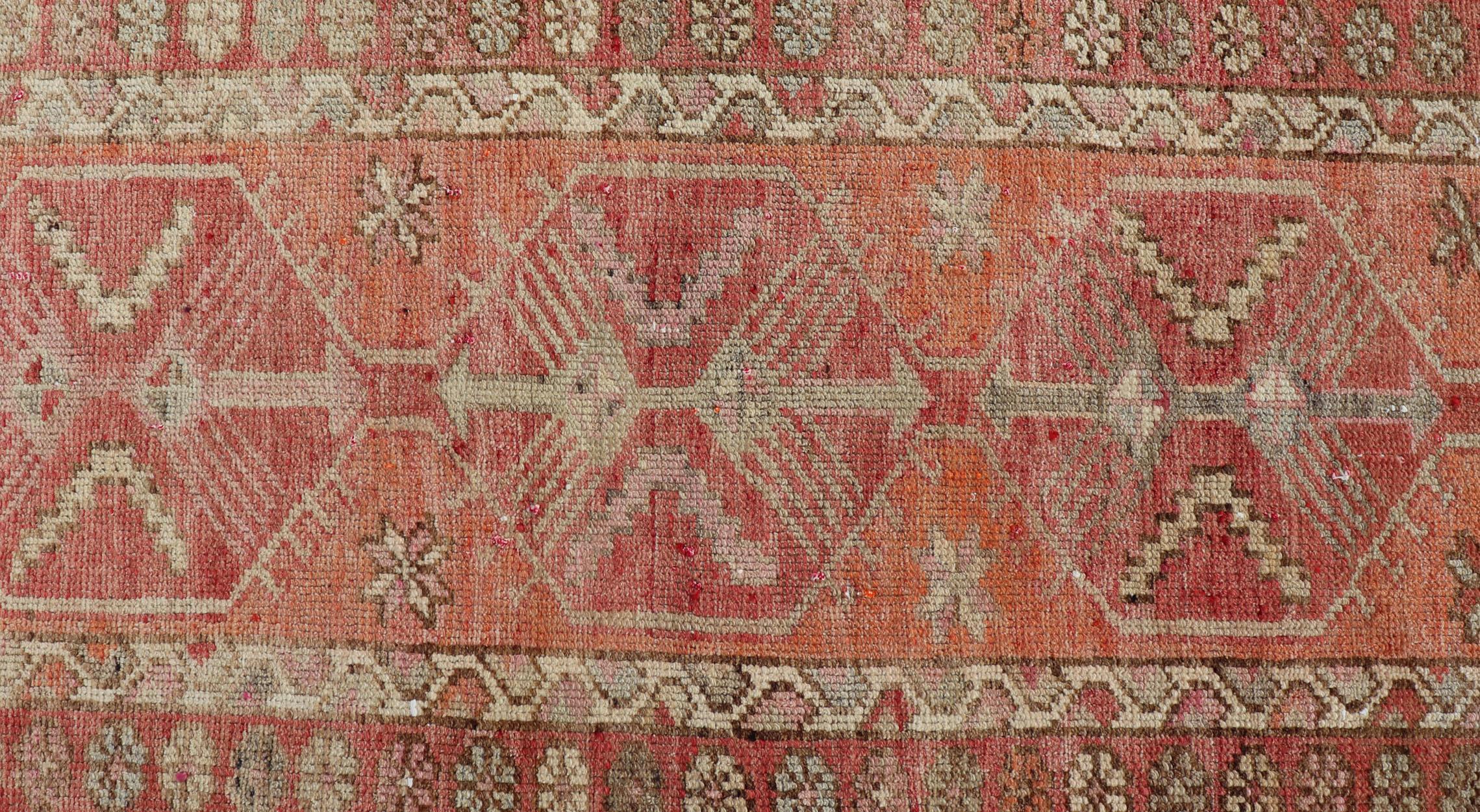 Measures: 2'10 x 14'7 
Vintage Turkish Runner with Tribal Medallion Design in Variegated Red. Keivan Woven Arts / rug TU-NED-4679, country of origin / type: Turkey / Oushak, circa 1940

This expansive runner from Turkey features a colorful pattern