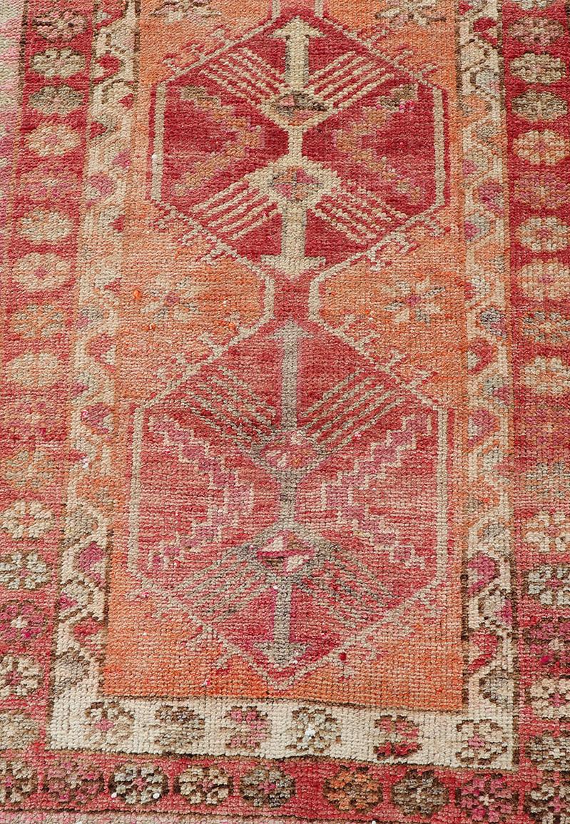 Hand-Knotted Vintage Turkish Runner with Tribal Medallion Design in Variegated Red For Sale