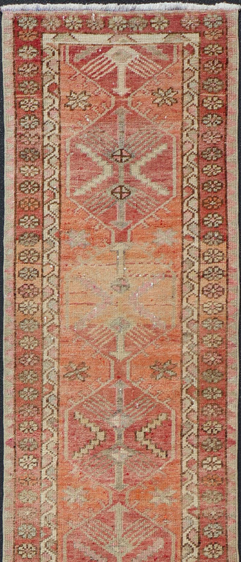 20th Century Vintage Turkish Runner with Tribal Medallion Design in Variegated Red For Sale