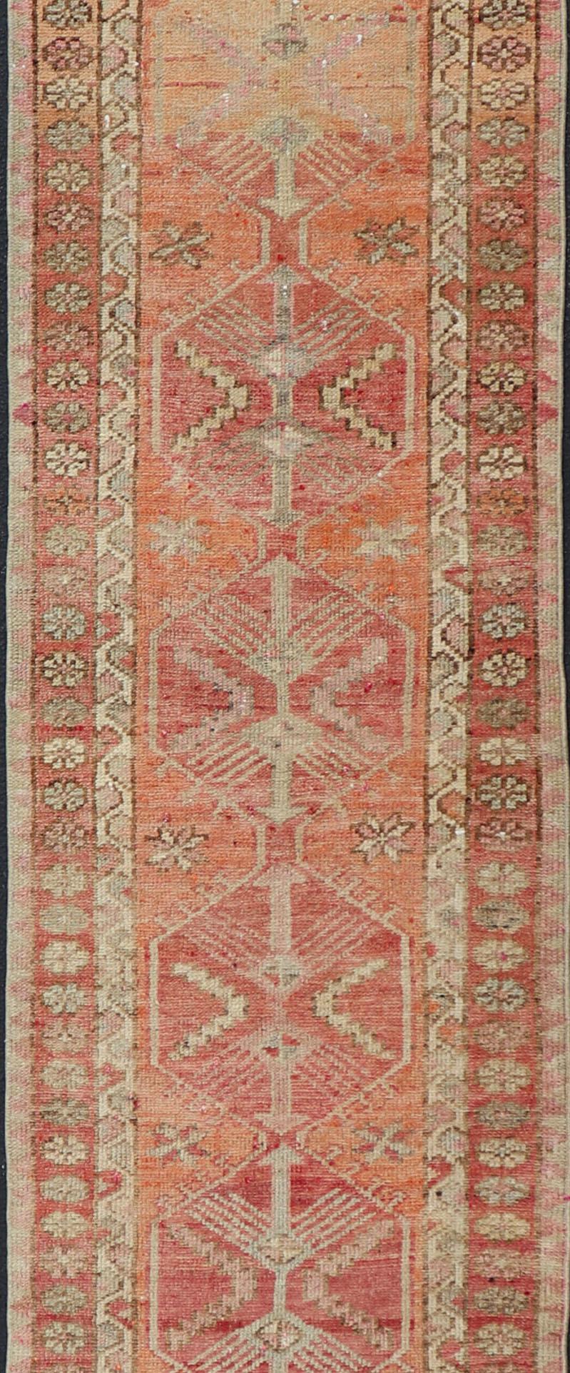 Wool Vintage Turkish Runner with Tribal Medallion Design in Variegated Red For Sale
