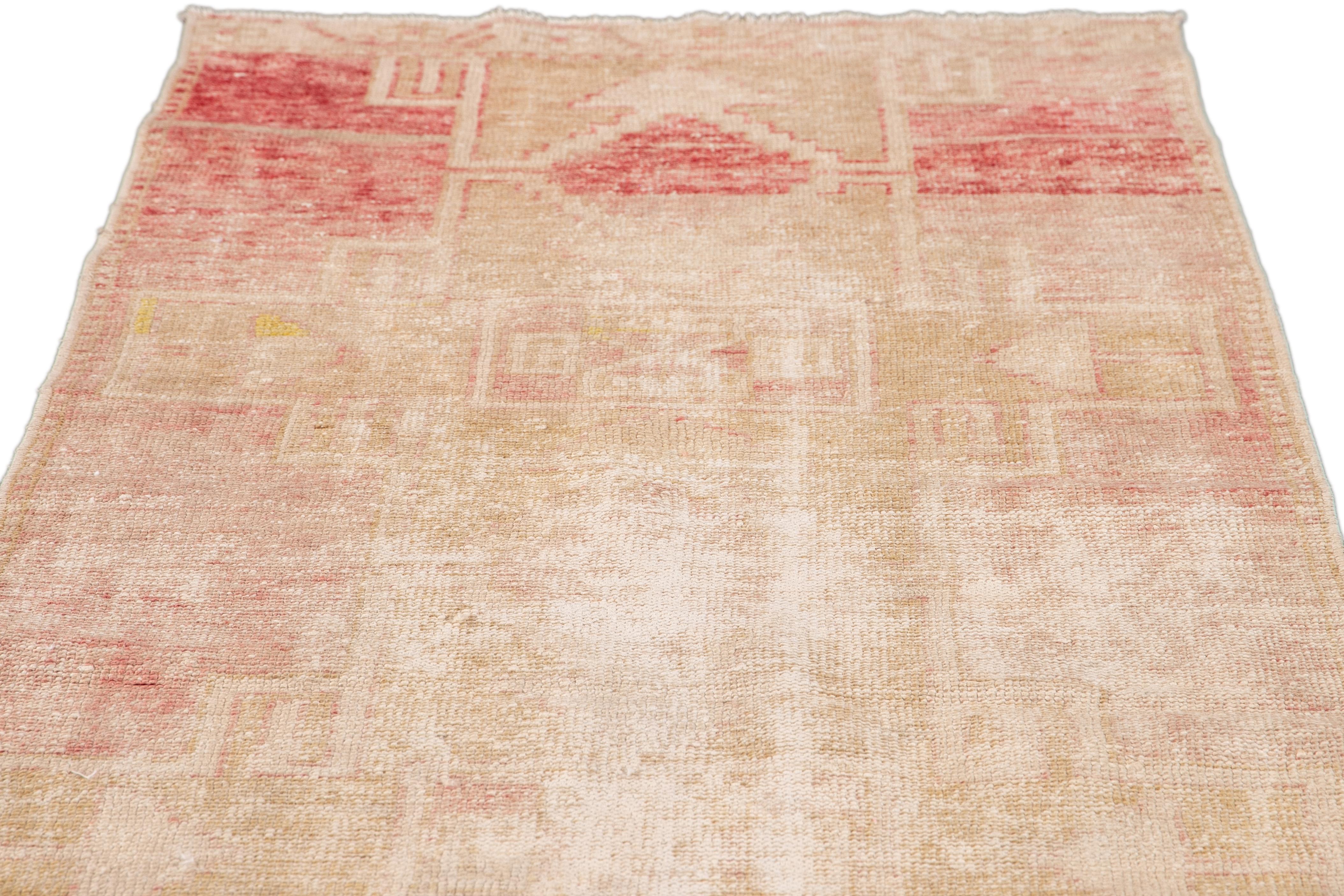 20th Century Vintage Turkish Shabby Chic Beige and Pink Handmade Geometric Wool Runner For Sale