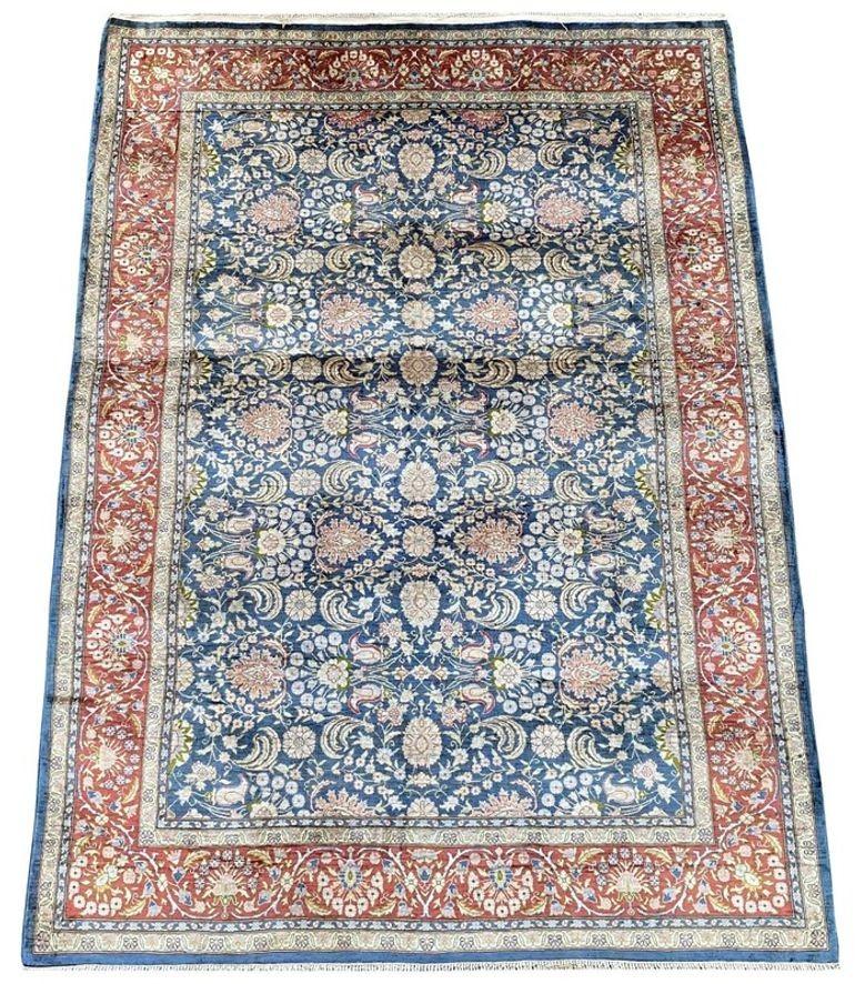 An exceptional silk Turkish rug, handwoven in Hereke (about 60 kms south-east from Istanbul) circa 1980 with an all over floral design on a soft blue field and fabulous secondary colours of pink, red green and gold. very finely woven with 10x10