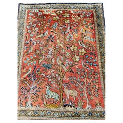 Tapis vintage en soie turque Hereke représentant l'arbre de vie en rouge rouille, bleu et vert