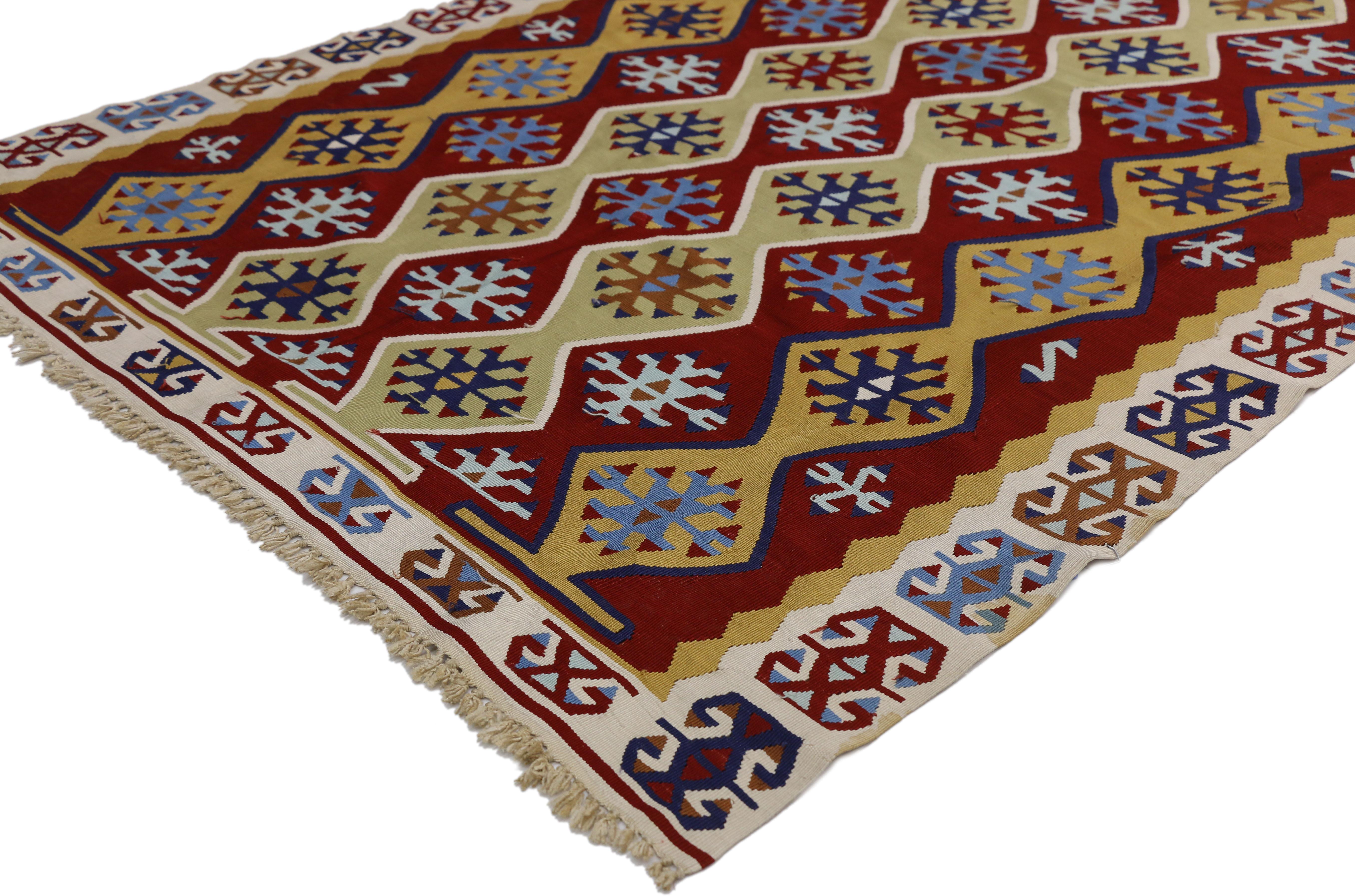 ​70792 Vintage Turkish Silk Kilim Rug with Modern Tribal Style. ​With its vibrant earth-tone colors and tribal style, this hand-woven silk Turkish kilim rug manages to meld contemporary, modern, and traditional design From golden yellow and navy to