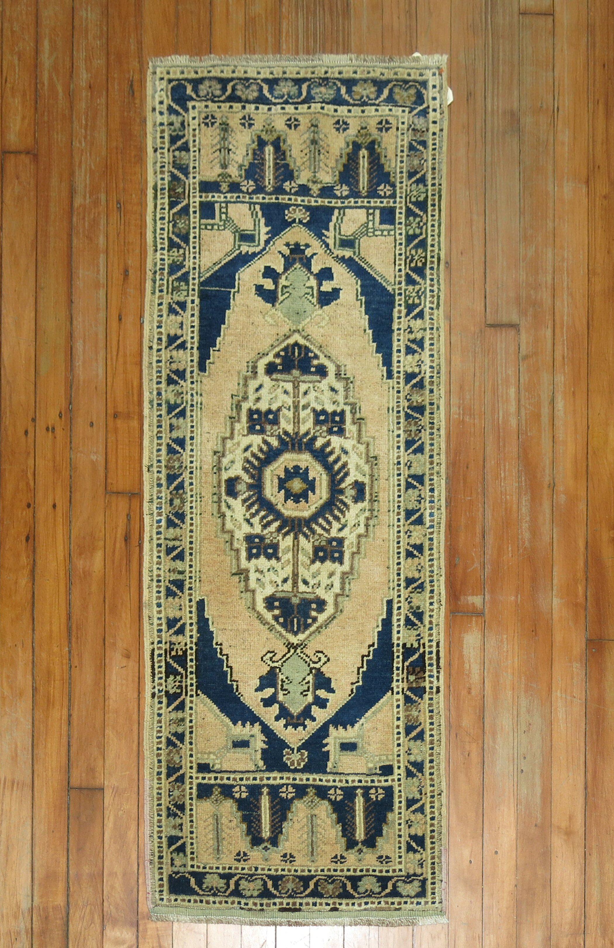 One of kind vintage Turkish throw rug.

Measures: 20'' x 51''.