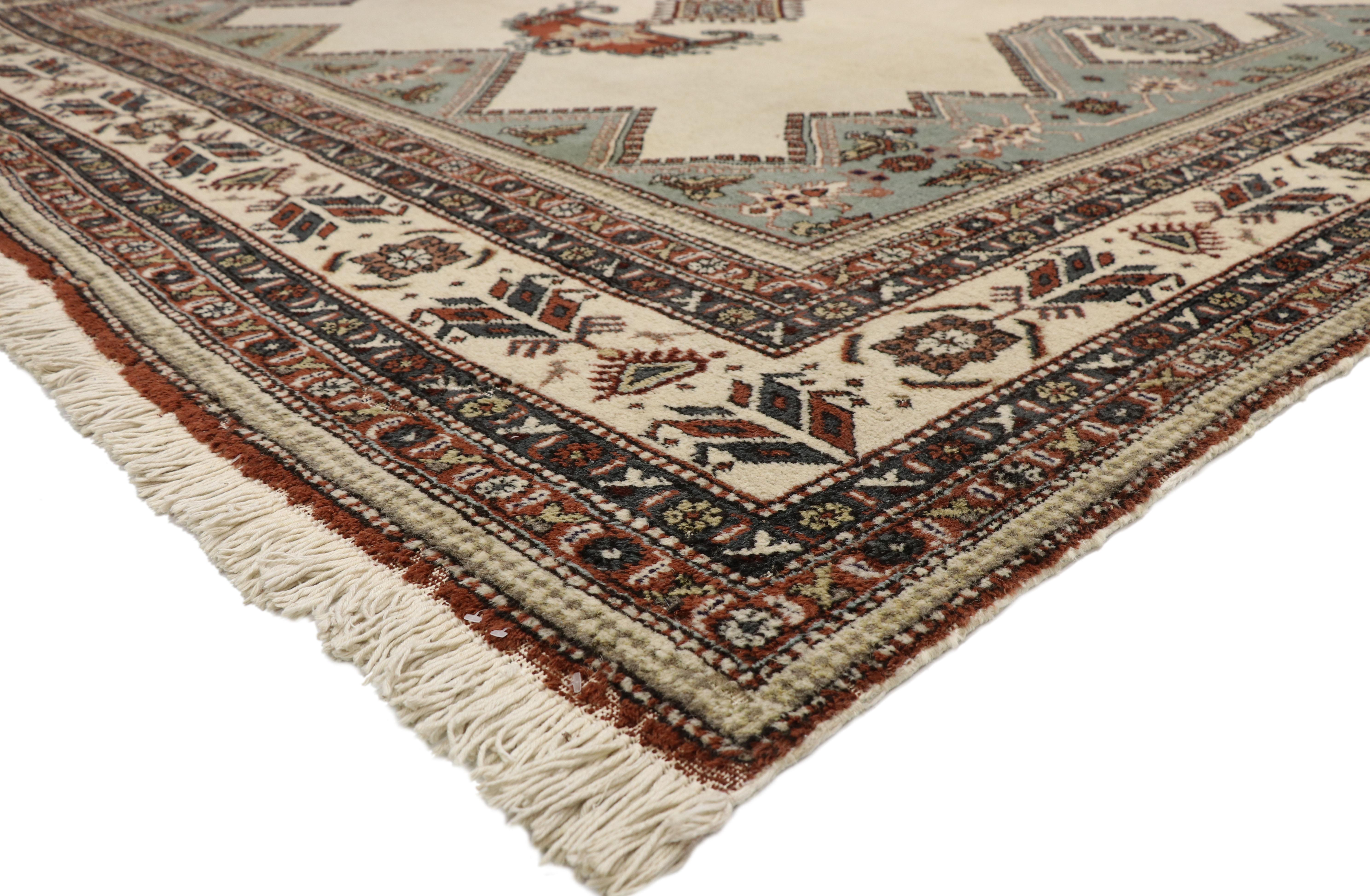 77362, vintage Turkish Sparta rug with Caucasian Qashqai Shiraz tribal style. Displaying nomadic charm and nomadic tribal style, this vintage Turkish Sparta rug is an amalgam of Caucasian Qashqai tribe influence. This hand knotted wool vintage