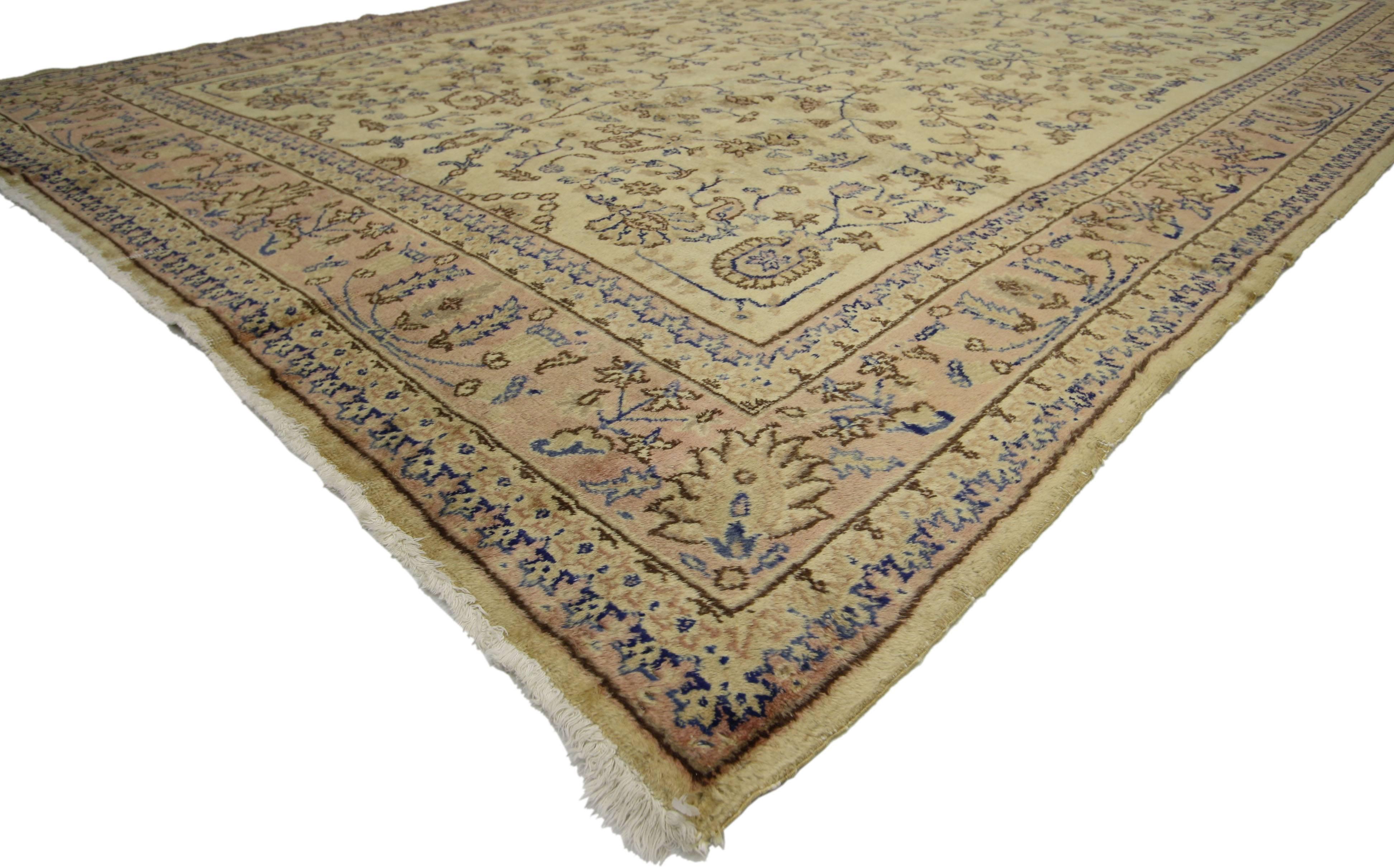 70246 Vintage Turkish Sparta Rug with Romantic French Provincial Style 08'04 x 11'10. This hand knotted wool vintage Turkish Sparta rug with light colors features an all-over botanical pattern composed of blooming florals, palmettes and meandering
