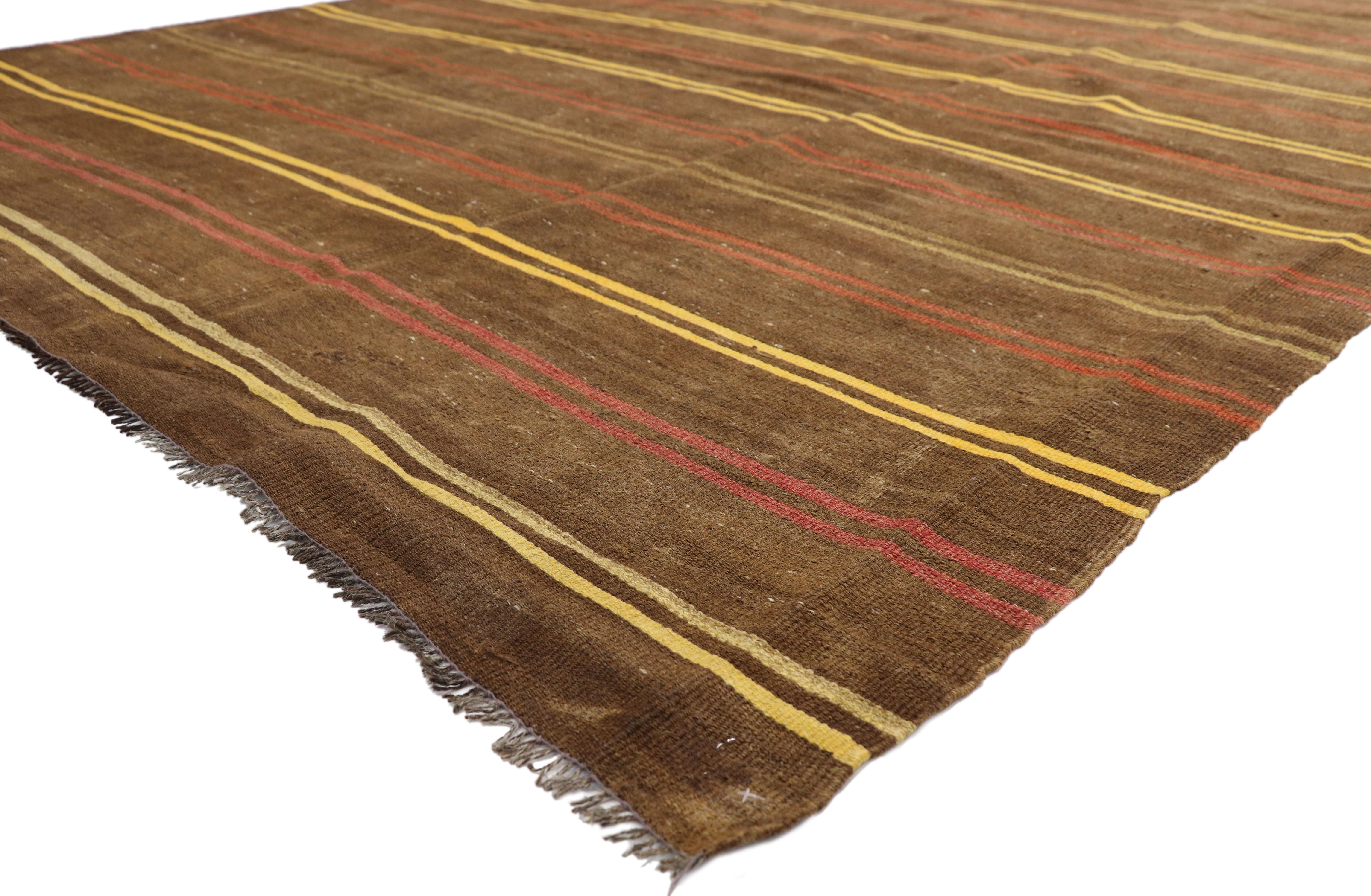 51320, vintage Turkish striped Kilim rug with Bohemian Tribal style, flat-weave rug. This handwoven wool vintage Turkish striped Kilim rug features double colored bands in alternating colors dotted with a few symbolic Turkish motifs on a warm brown