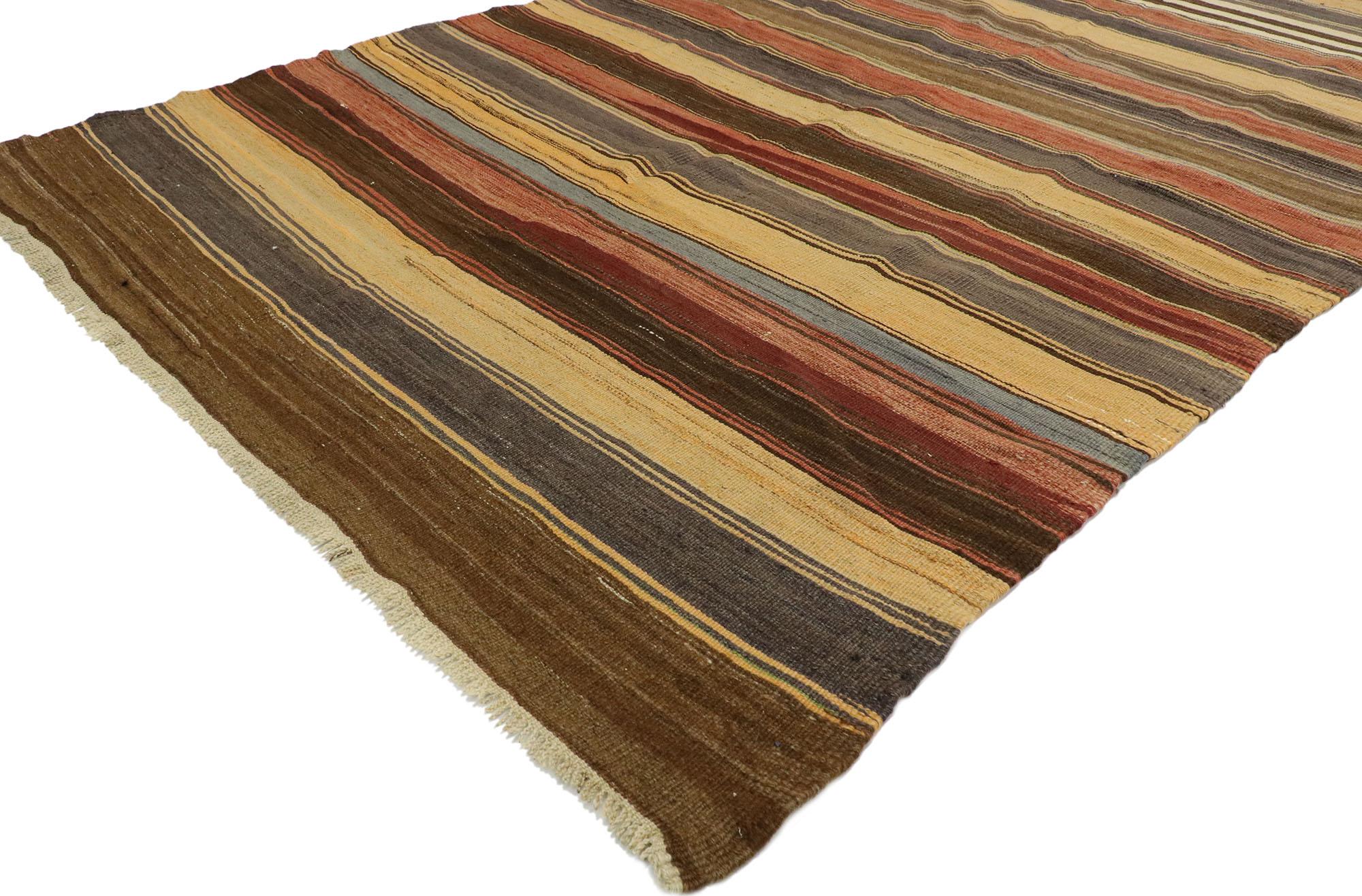 53128, vintage Turkish striped Kilim rug with modern rustic cabin style. With its warm hues and rugged beauty, this handwoven wool striped kilim rug manages to meld contemporary, modern, and traditional design elements. The flat-weave kilim rug