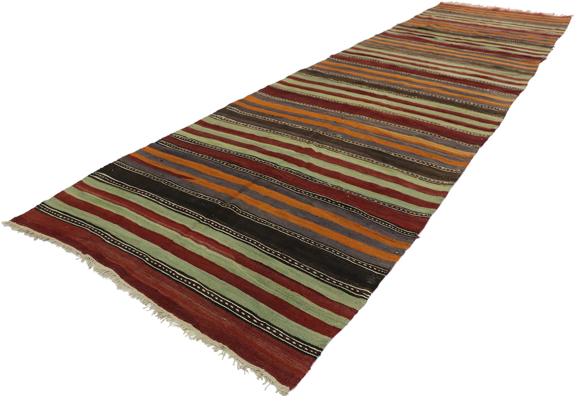 53129, vintage Turkish striped Kilim runner with modern cabin style. With its warm hues and rugged beauty, this hand-woven wool striped kilim runner manages to meld contemporary, modern, and traditional design elements. The flat-weave kilim rug