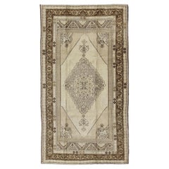 Vintage Turkish Stylized Medallion Oushak Rug in Sandy Neutrals and Earth Tones