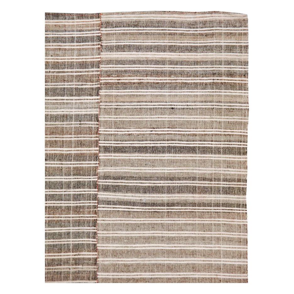 A vintage Turkish textile flat-weave rug in the style of Kilim rugs from the mid-20th century.