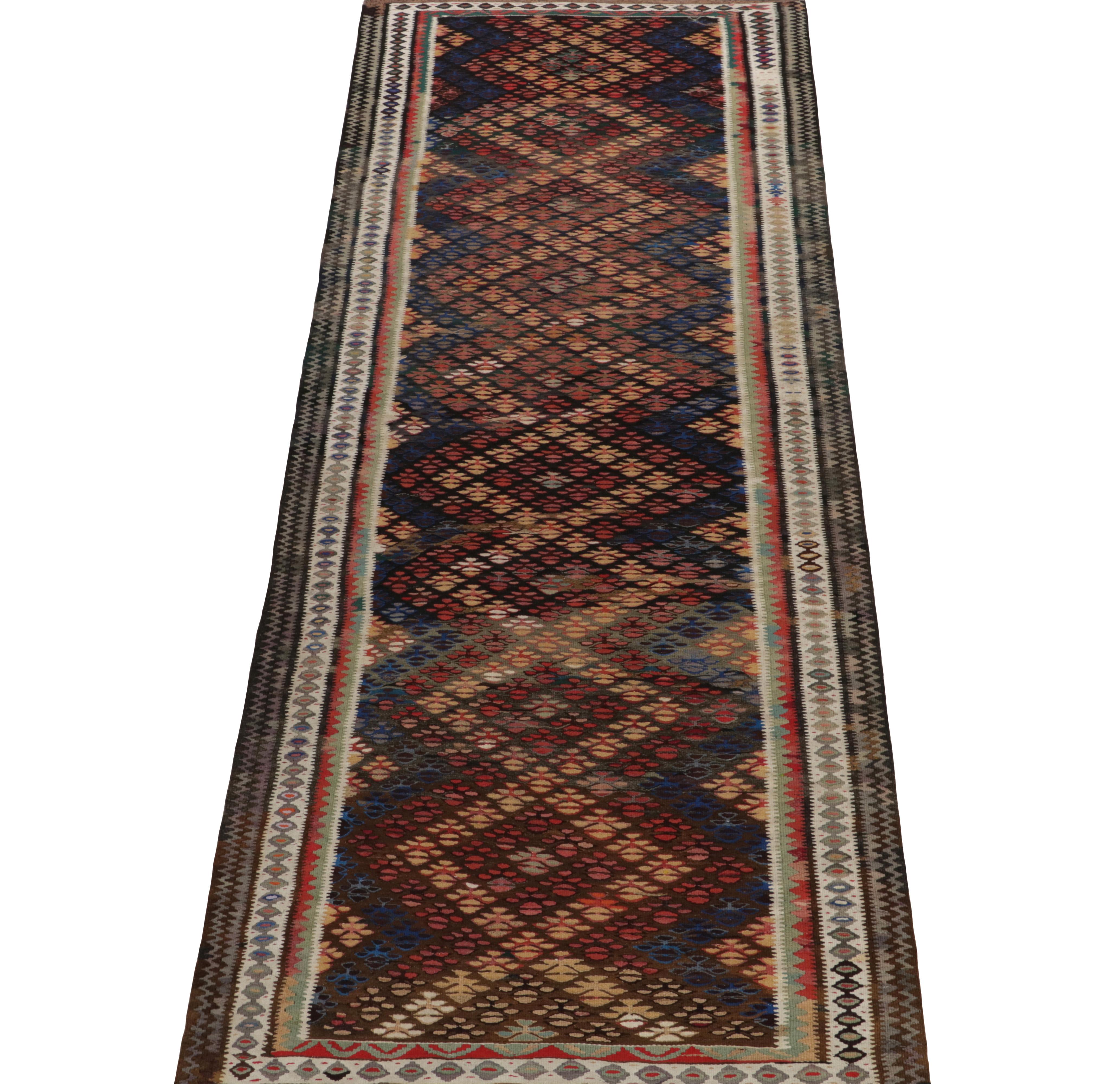 Handwoven in Fine wool, a 3x9 vintage Kilim runner from Turkey, now joining our coveted tribal collection. Carrying a subtly more dense weave for its era, the 1950s piece reflects mosaic-like pagination of geometry in tones of blue, red, gold, gray