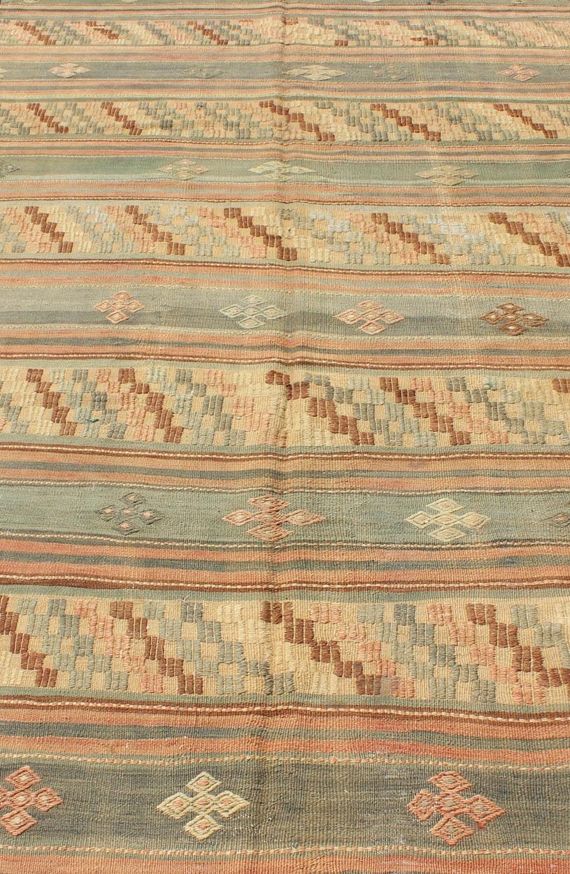 Hand-Woven Vintage Turkish Tribal Kilim with Striped Design in Earthy Tones For Sale