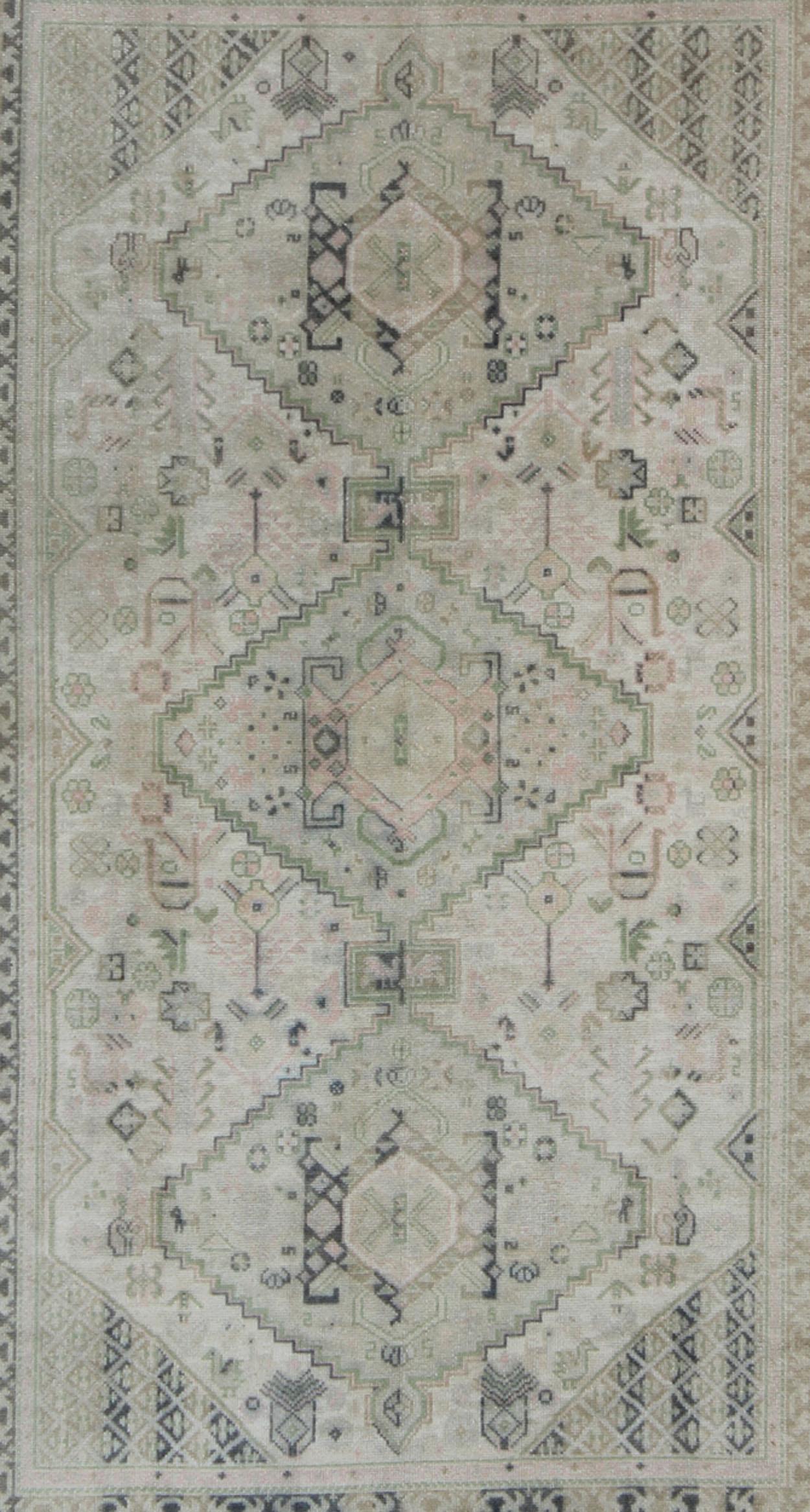 Hand-Knotted Vintage Turkish Tribal Medallion Oushak in Muted Green, Pink, and off White For Sale