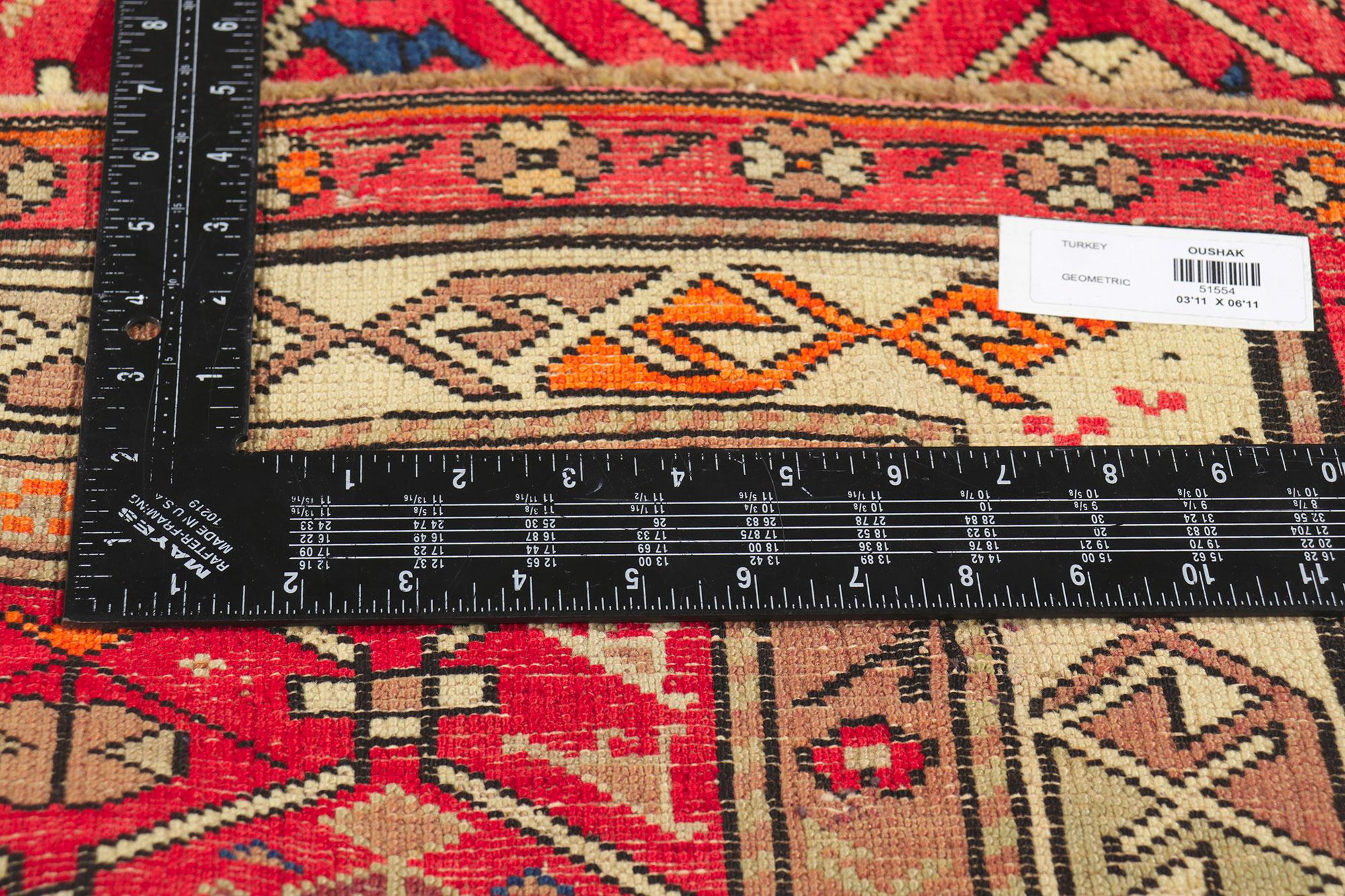 Wool Vintage Turkish Tribal Oushak Rug with Vibrant Earth-Tone Colors For Sale