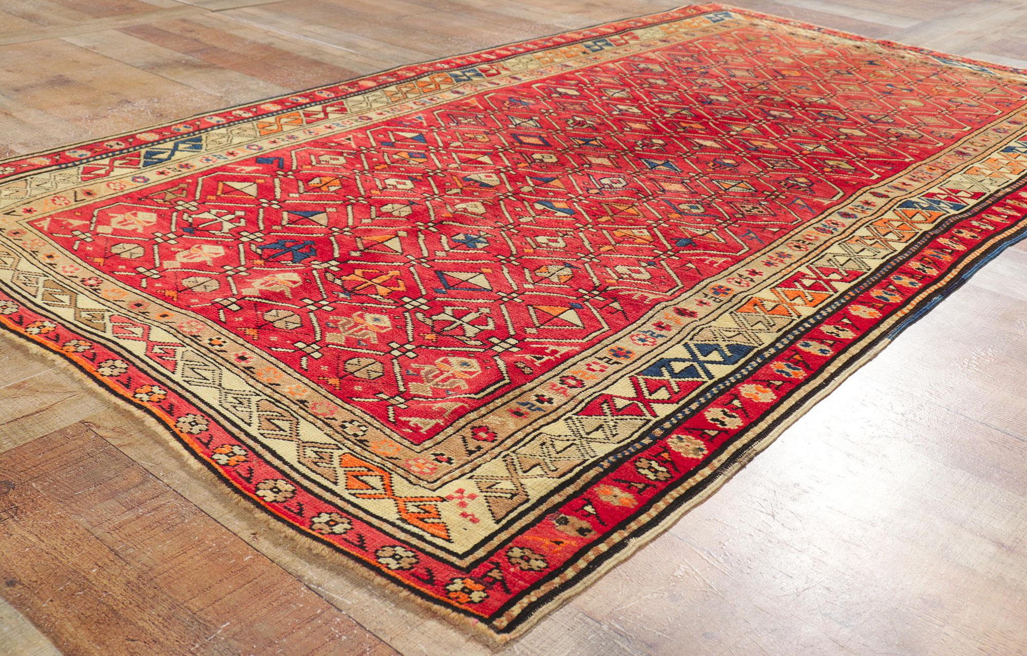 Vintage Turkish Tribal Oushak Rug with Vibrant Earth-Tone Colors For Sale 1