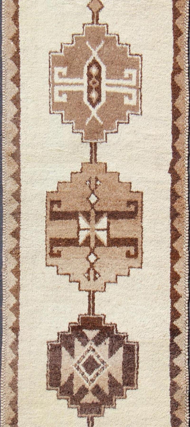 Hand-Knotted Vintage Turkish Tulu Gallery Rug with Tribal Motifs in Shades of Brown and Cream For Sale