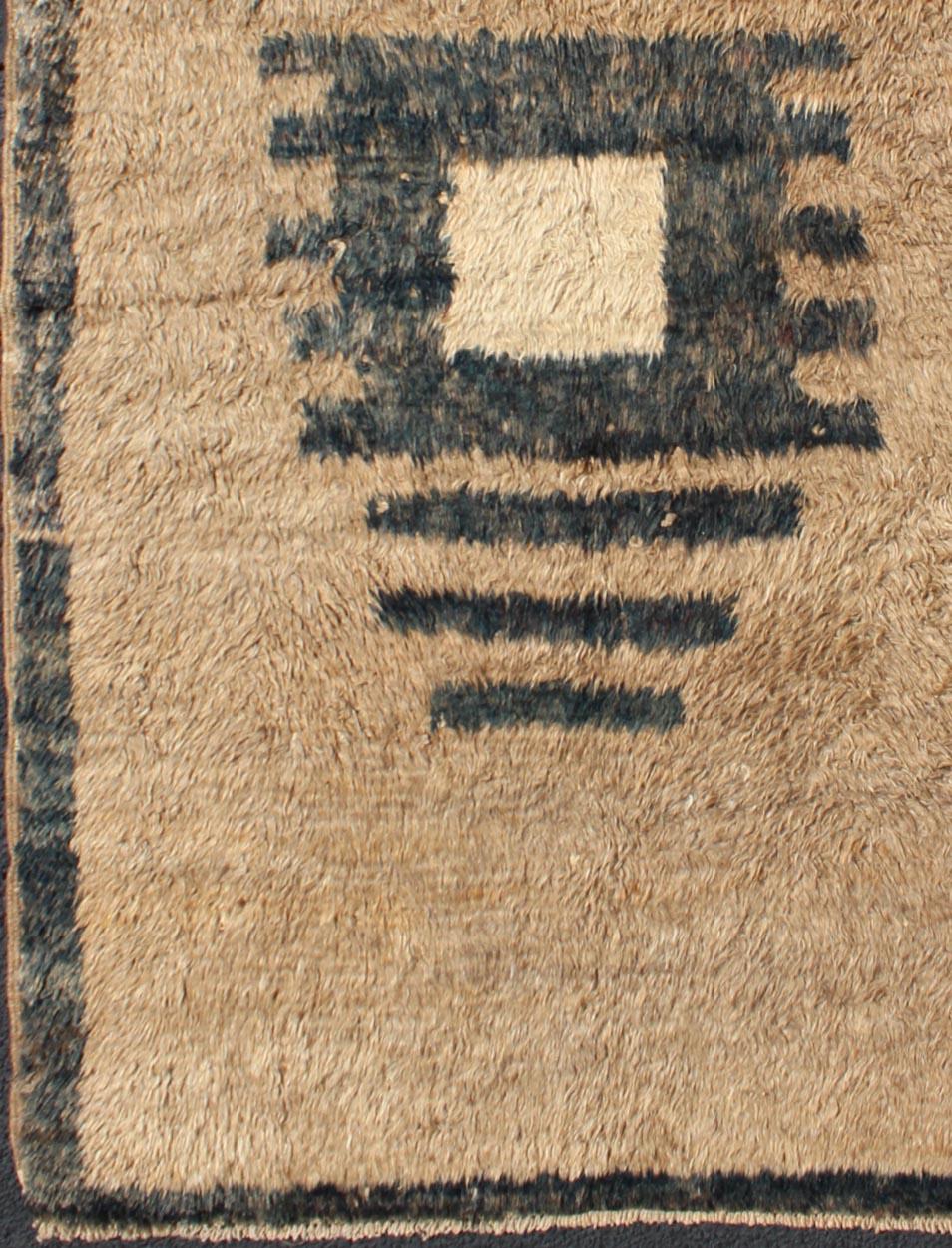 This Anatolian Tulu rug from Turkey is distinguished by a Minimalist design with a modern design geometric medallion. This Mid-Century Tulu features a unique color combination, which magnifies the bold geometric nature of this rug. The two colors