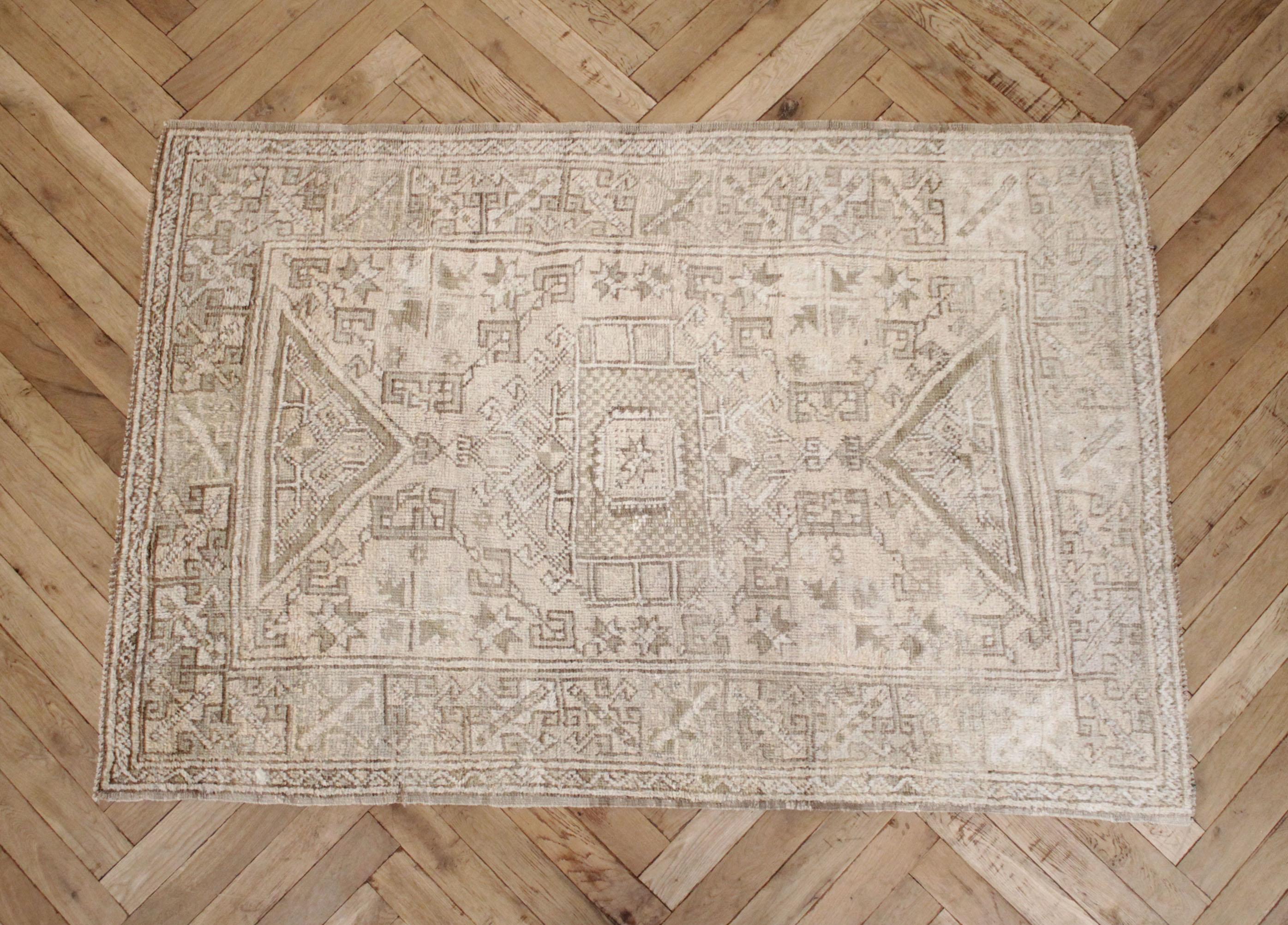 100% wool
This vintage Turkish rug has a very soft feel with light pile. Perfectly faded taupes, creams and browns.
While most rugs are stiff this style of rug is not stiff, and has more of a soft foldable quality.
Size: 47