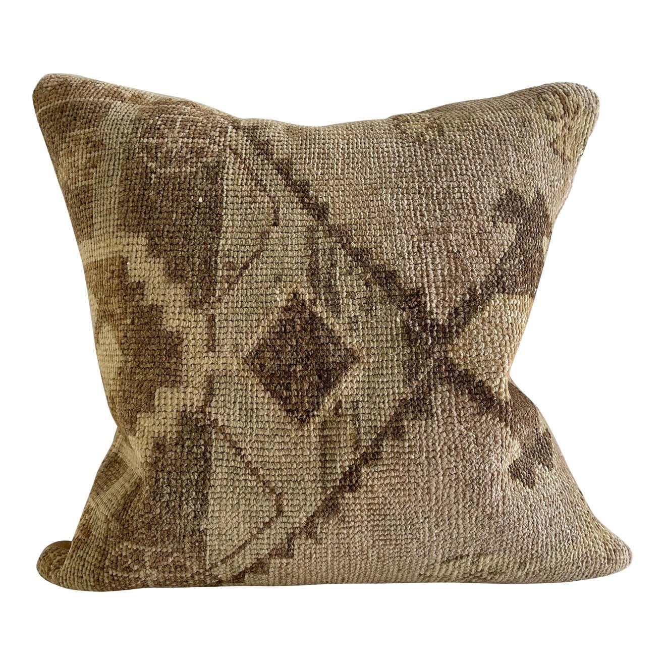 Custom made accent pillow from a beautiful 19th c Turkish rug. all textiles have been professionally cleaned prior to construction. Colors: Browns, creams, taupes, and neutral tones. Backside is natural cotton.
Size 18” x 18”.