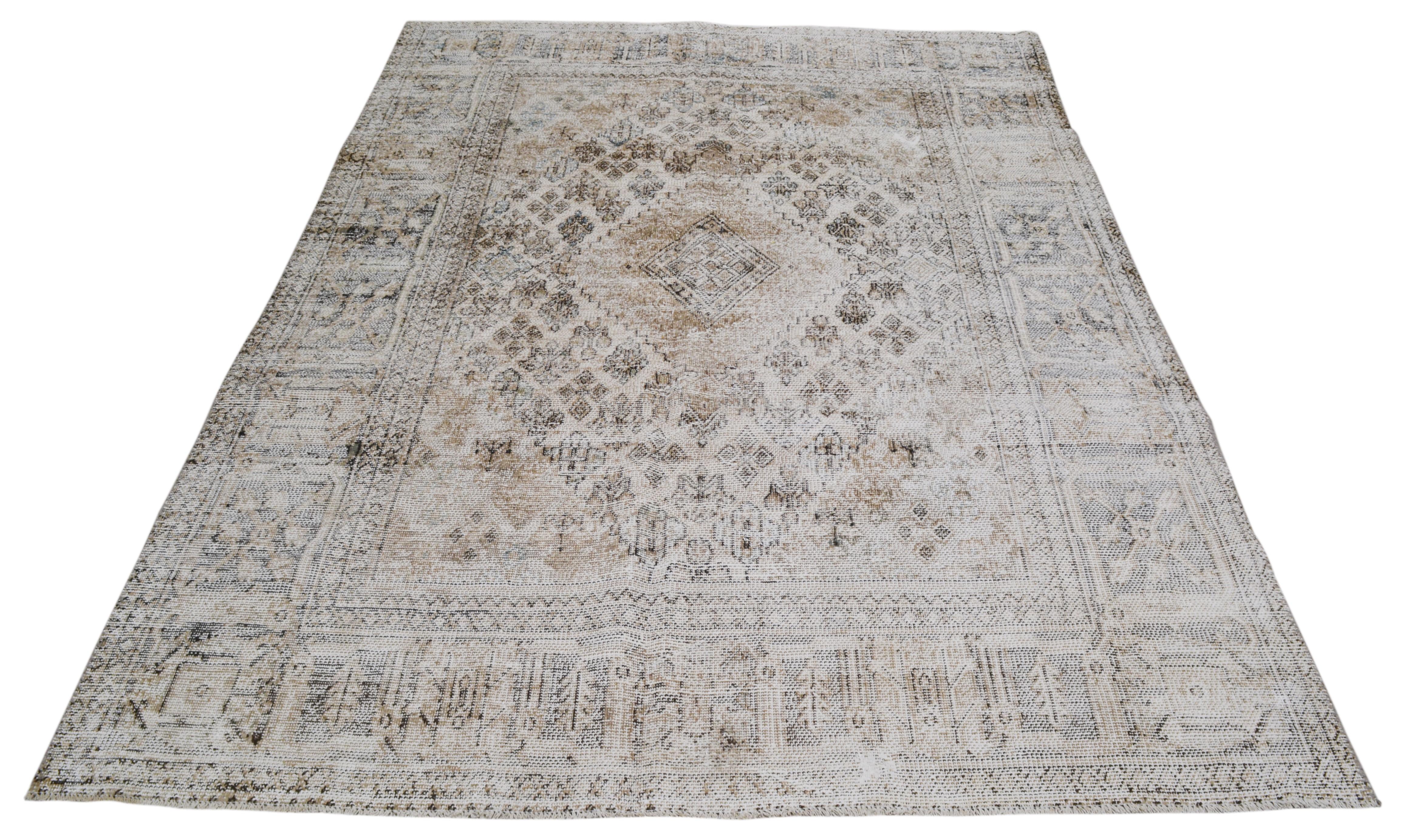Beautiful heirloom-quality antique Tabriz area rug with neutral tones and an intricate geometric pattern. 
Please note that as a vintage item this piece may have imperfections, pattern and/or color variations which is considered normal and only