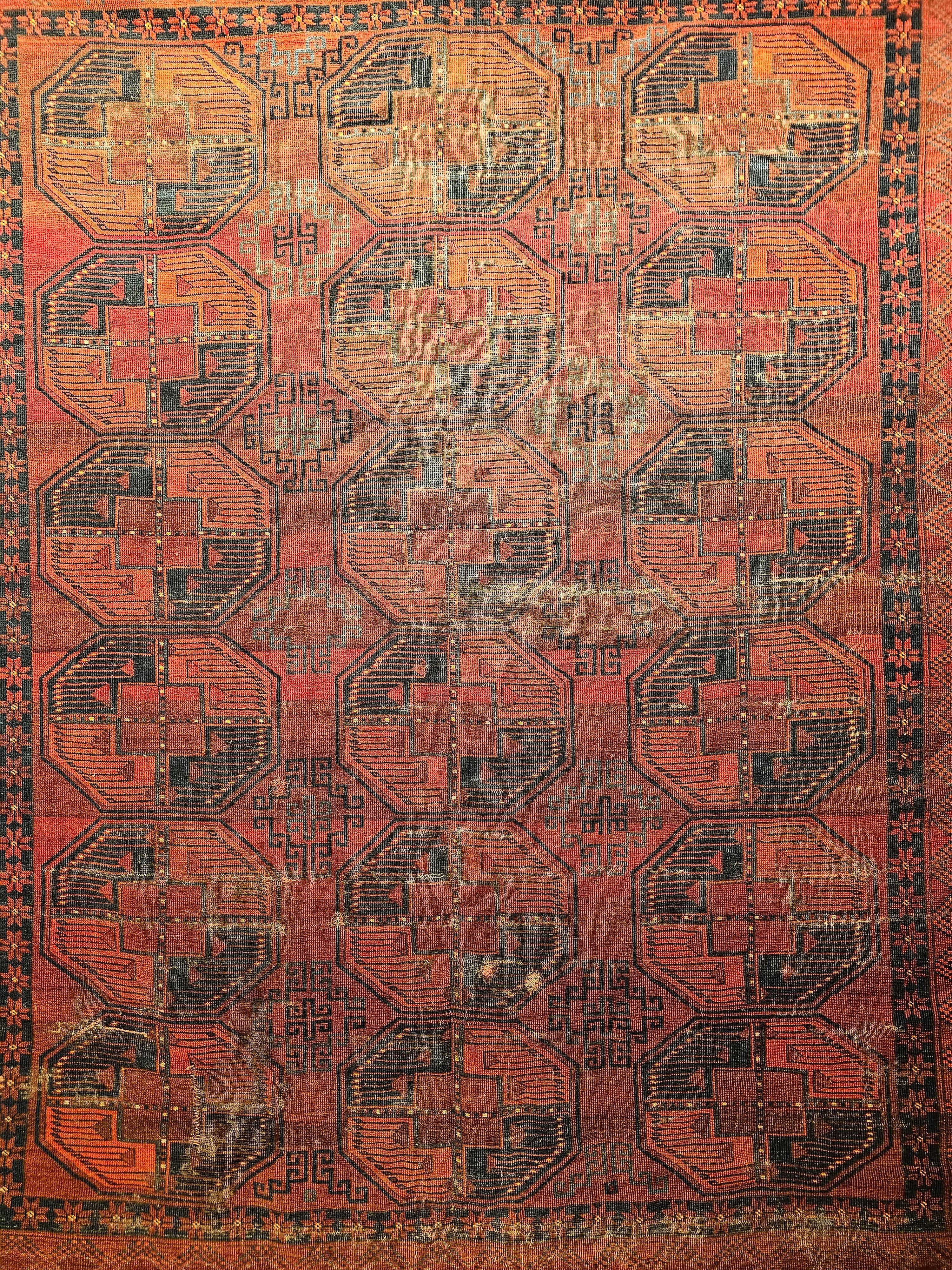 A “near square” room-size Turkmen Ersari rug in an allover geometric 