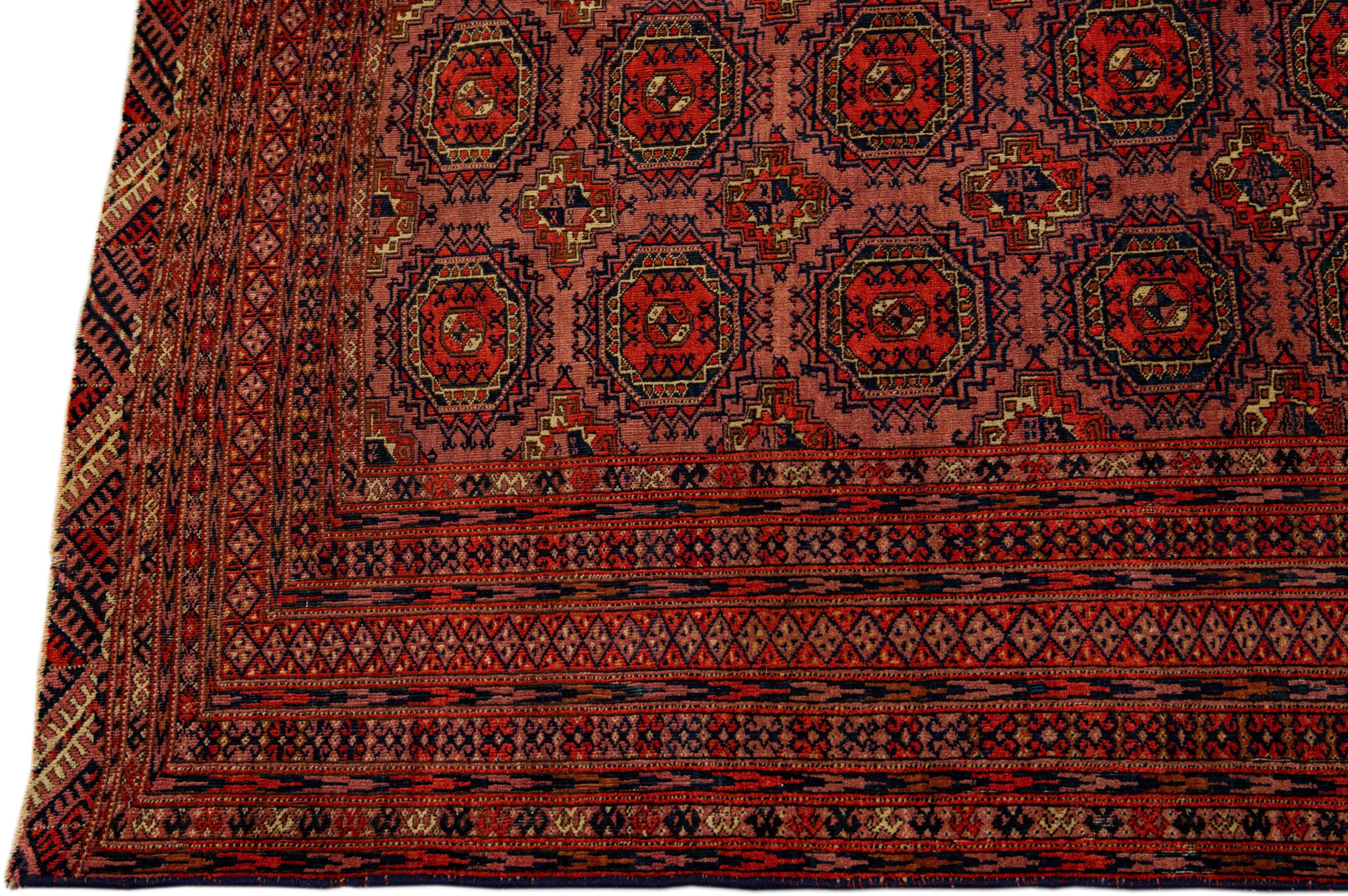 Hand-Knotted Vintage Turkmen Handmade Geometric Persian Wool Rug with Terracotta Color For Sale