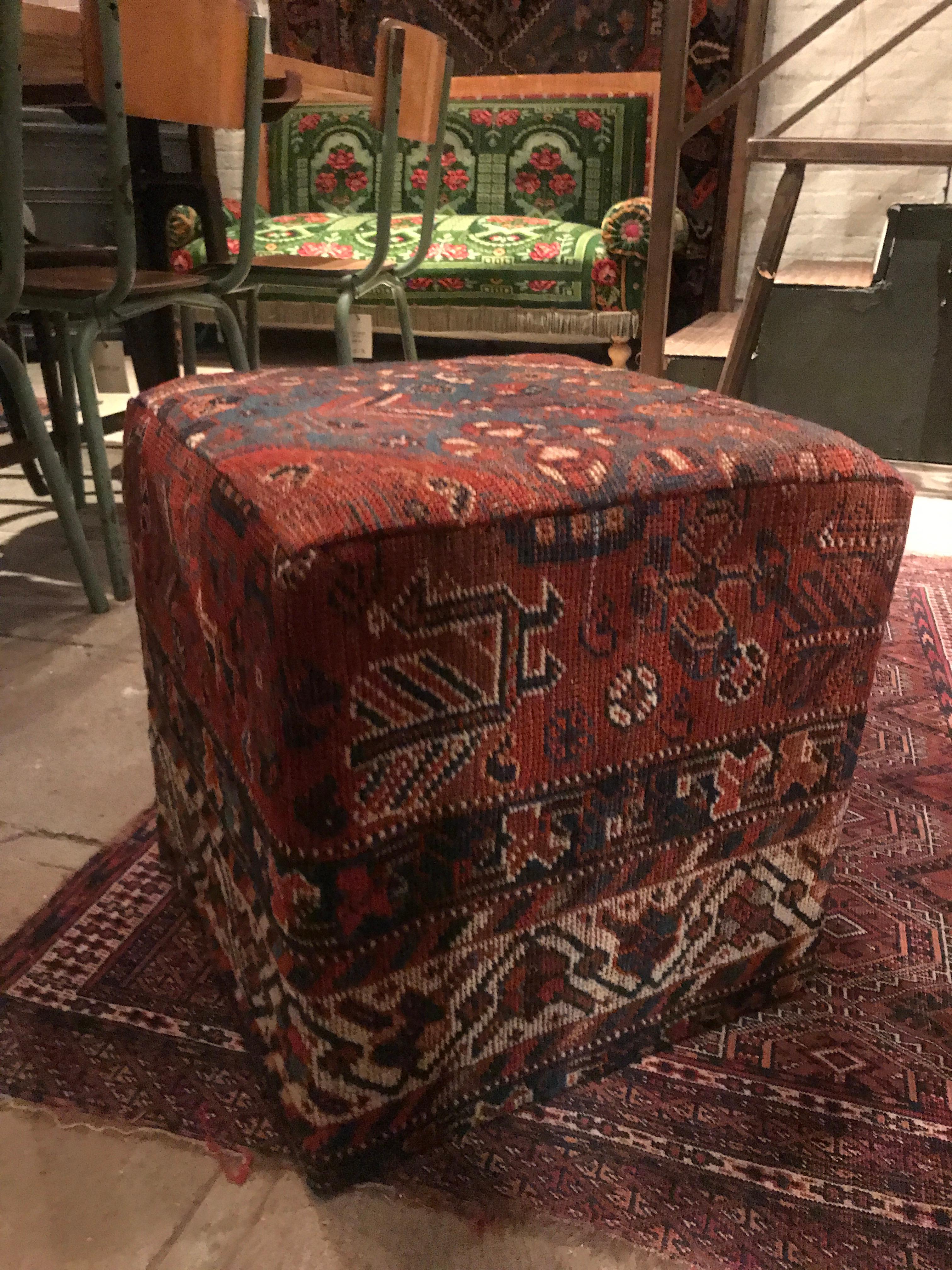 Rich colored vintage ottoman created with deconstructed vintage Turkmen rugs. Rigged wool covering perfect for a livable space.