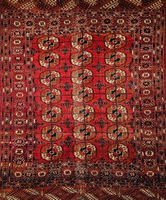 Alfombra Turkmen Tekke Vintage con diseño integral en rojo ladrillo, azul marino y marfil