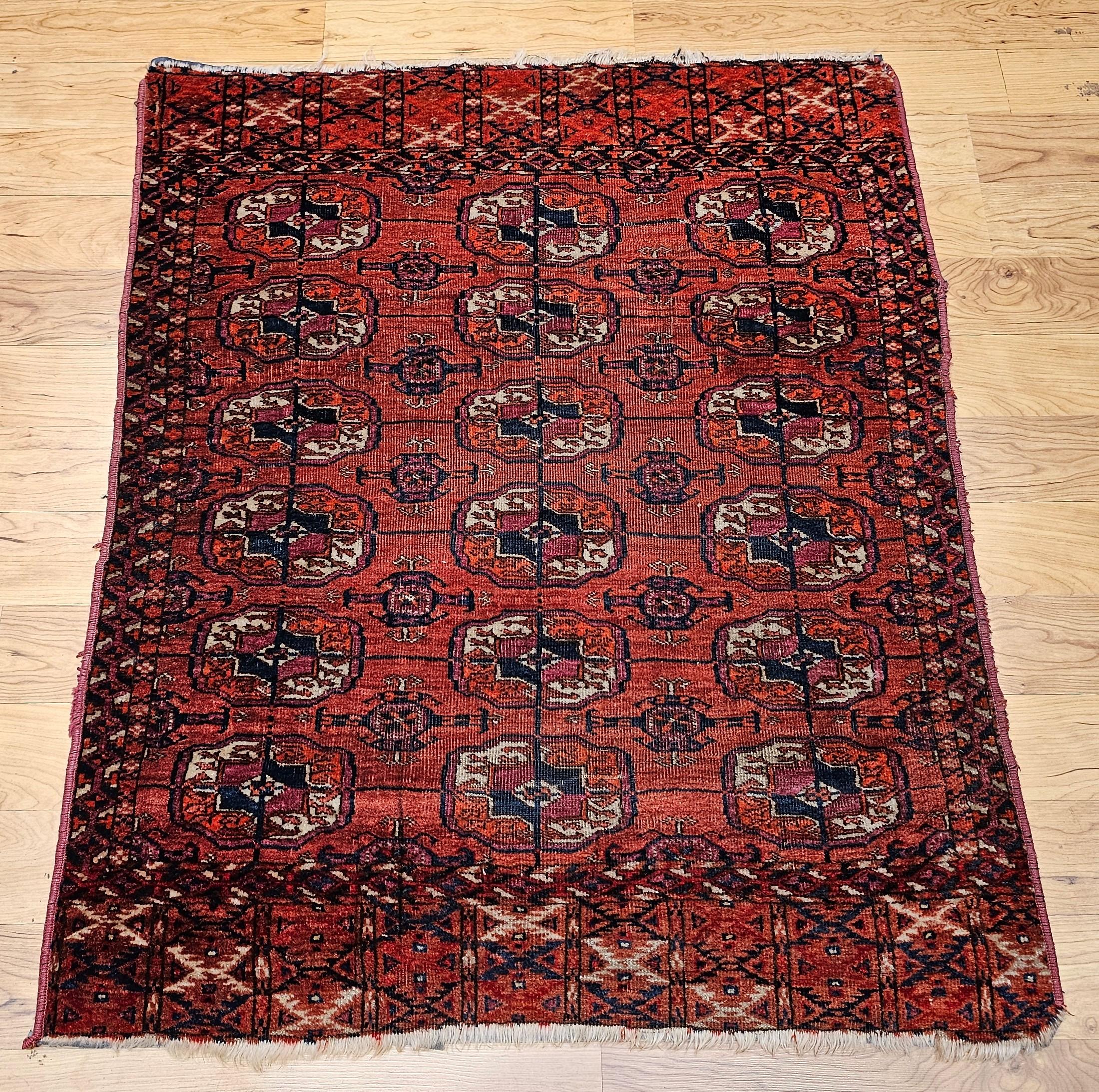 This exquisite late 19th-century Turkmen Tekke rug exemplifies the refined artistry and cultural heritage of Central Asian tribal weavings. Featuring a graceful allover pattern of small geometric medallions, this area rug is set against a rich