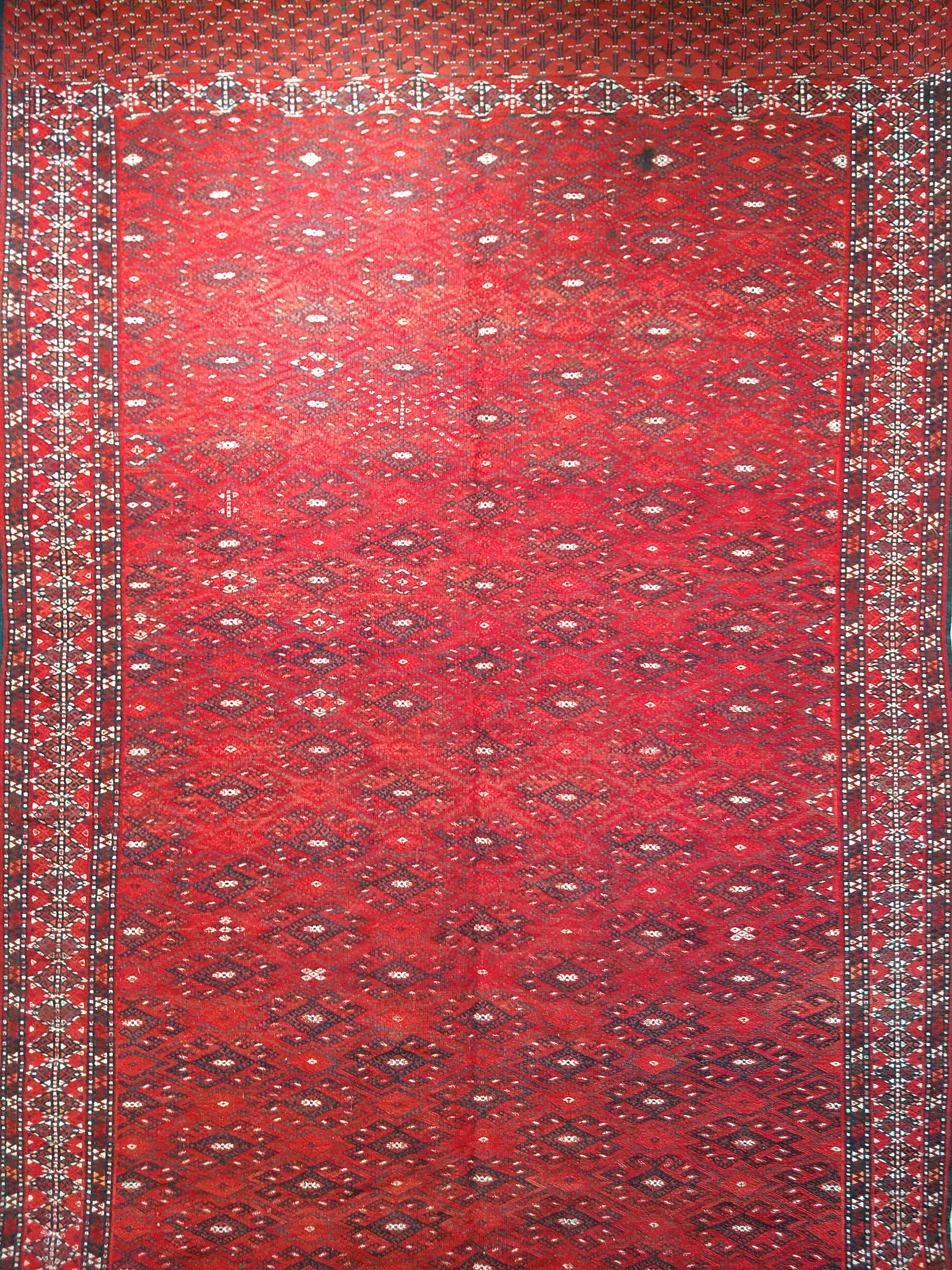 Vintage Turkmen Yomut Soumak rug from Central Asia circa the mid 1900s.  The soumak tapestry-woven has a wool foundation, a wool pile and is in an all-over design which results in a beautifully created tribal rug.  The main field color in this Yomut