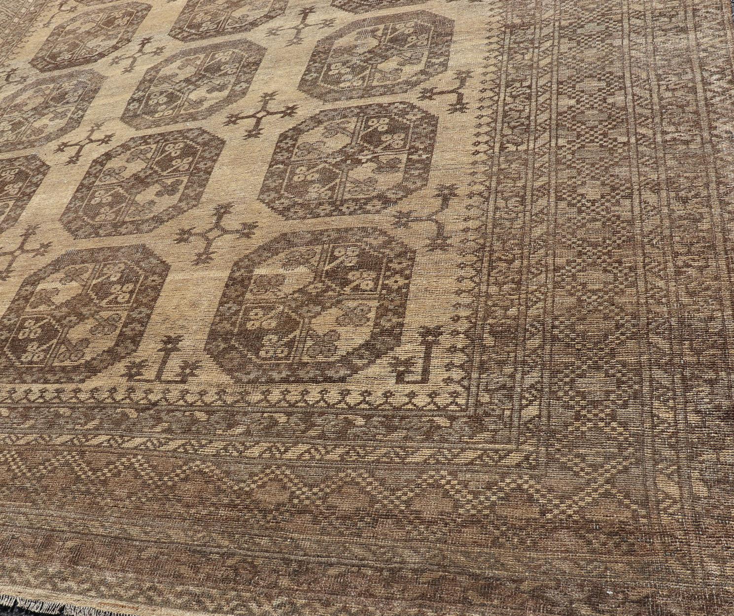 Square shape Vintage Turkomen Ersari rug with Gul design in brown, gray, tan & sand colors. Keivan Woven Arts; rug EMB-9660-P13538, country of origin / type: Turkestan / Ersari, circa 1940s.

Measures: 8'2 x 9'6.

This Ersari rug has been