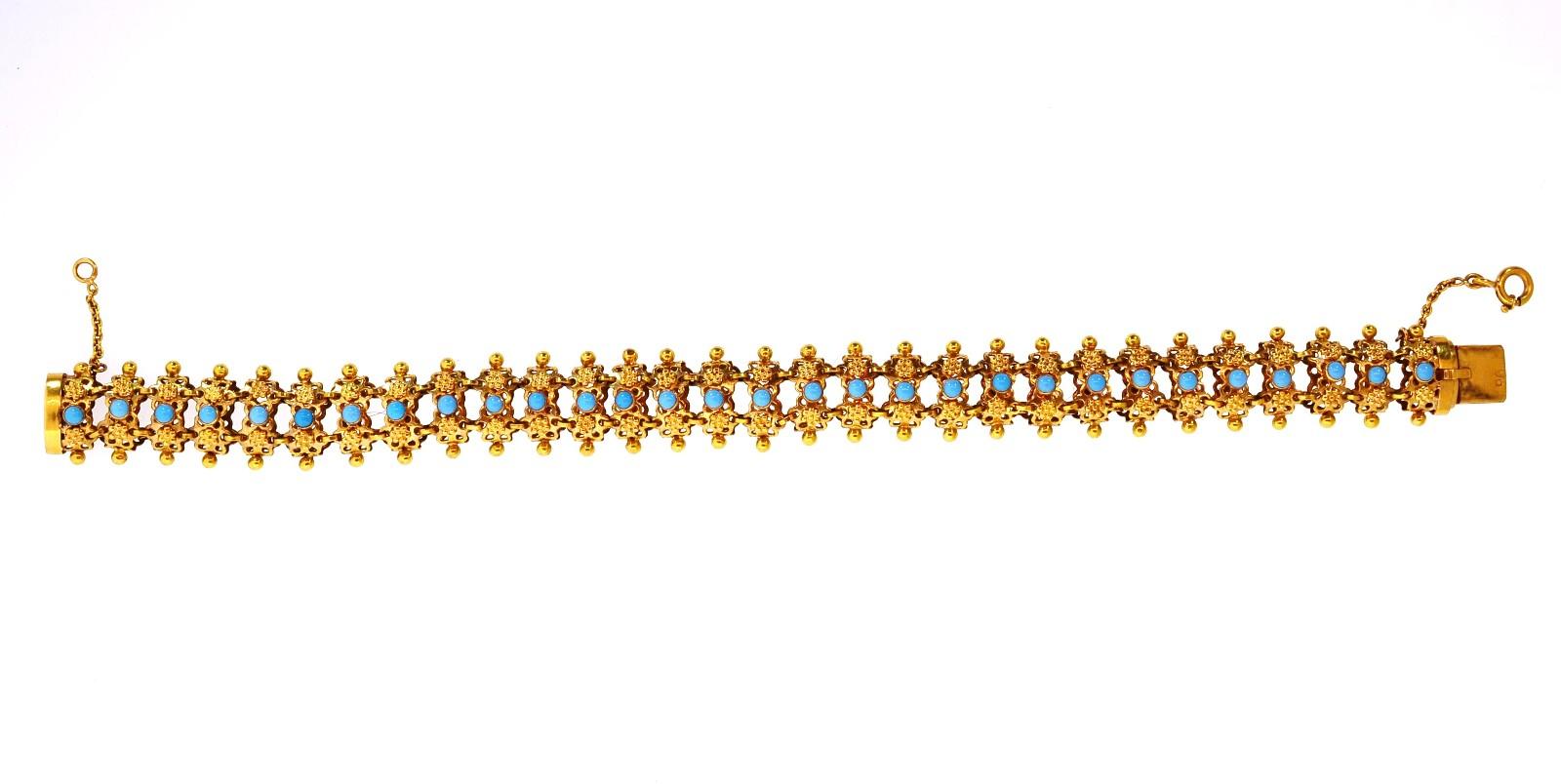 Soft as silk, this 1960s era 19KT yellow gold bracelet is a beautiful everyday wear.  Set with Turquoise cabochon down the middle, and gold beads along the sides.  It is stamped stamped 