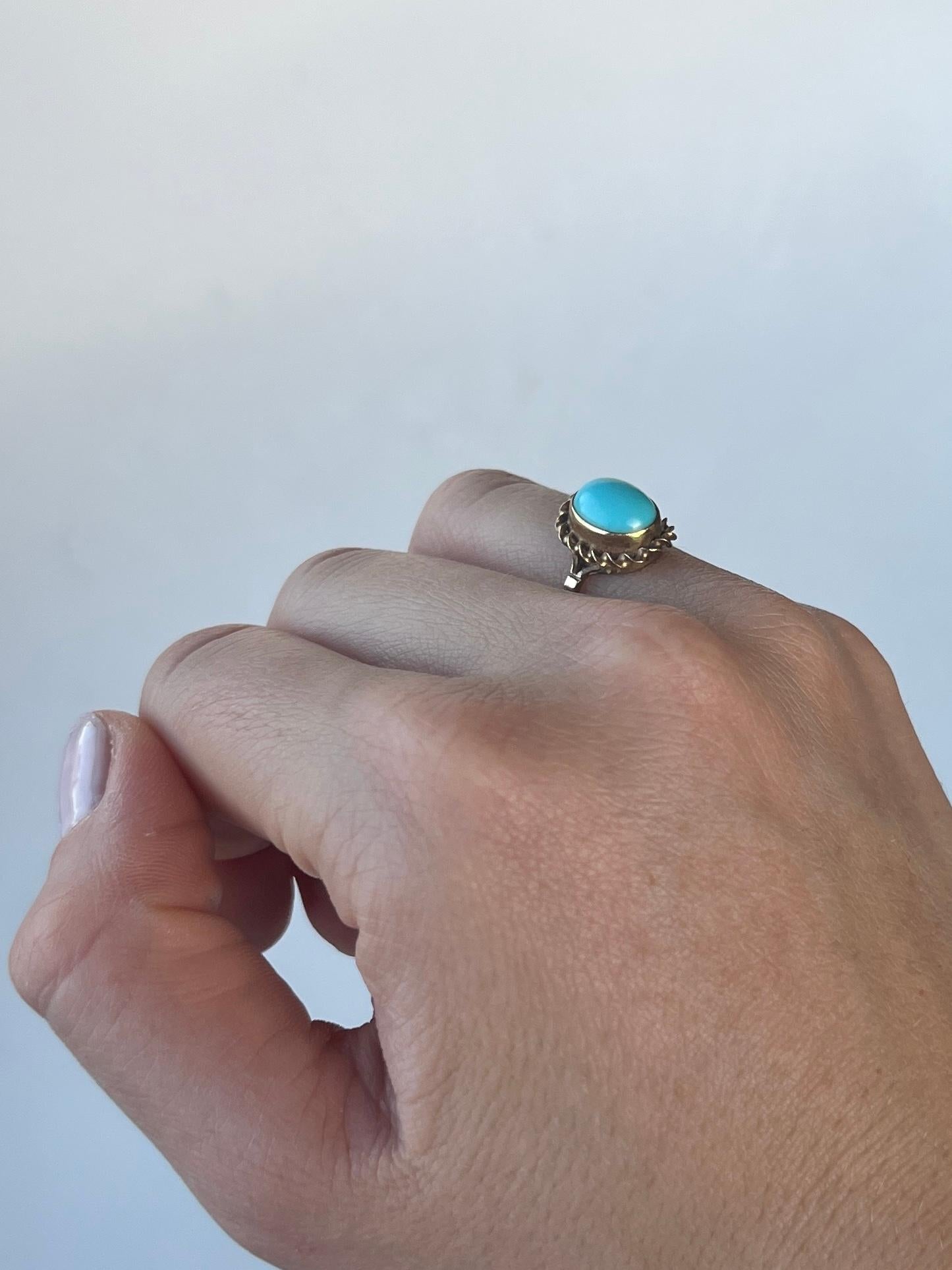 This glossy 9ct gold band holds abeautifully bright turquoise cabochon stone. The stone is bright and beautiful and complimented by the yellow gold perfectly. 

Ring Size: K 1/2 or 5 1/2 
Stone Dimensions: 10x7.5mm
Height off finger: 7mm

Weight: