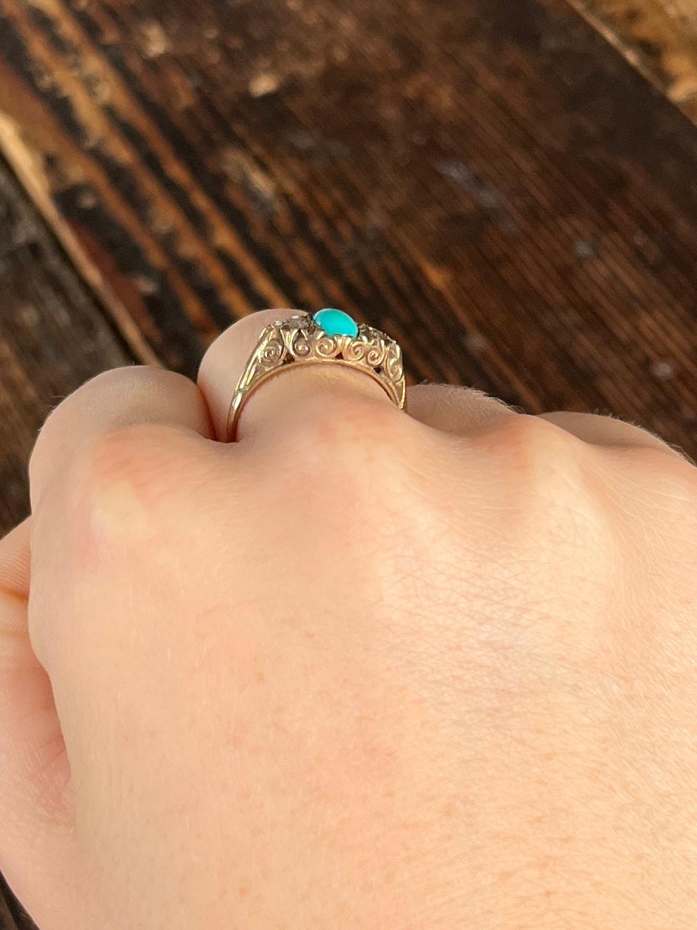 The central stone is a turquoise cabochon and either side it sit trios of diamonds. The diamonds total approx 18pts. Fully hallmarked Sheffield 1979 and modelled in 9 carat gold. 

Ring Size: N 1/2 or 7
Height Off Finger: 5mm

Weight: 2.5g