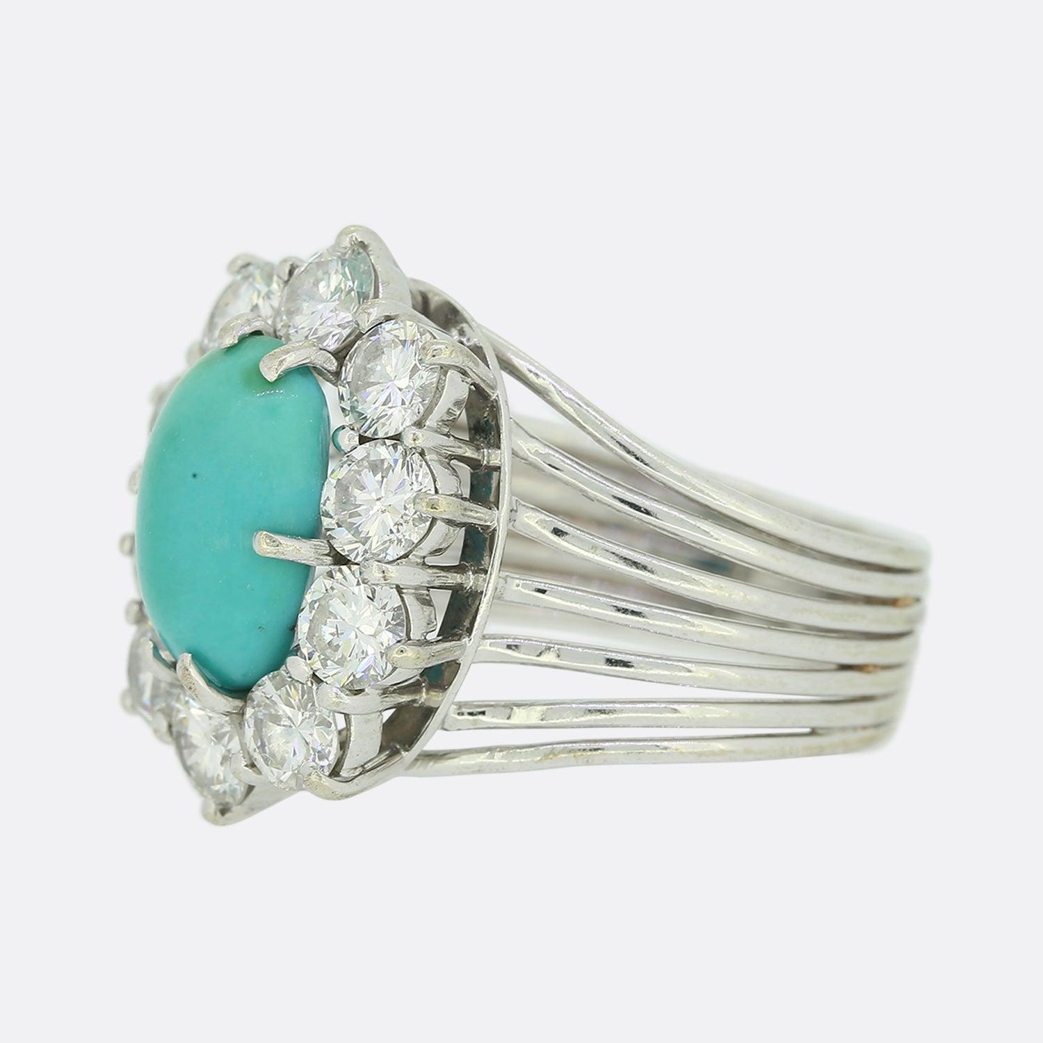 This is a vintage 18ct white gold turquoise and diamond cluster ring. The ring dates back to the 1980s and features a ribbed band and excellent quality diamonds.

Condition: Used (Very Good)
Weight: 5.0 grams
Size: K 1/2 (51)
Face Dimensions: 17mm x