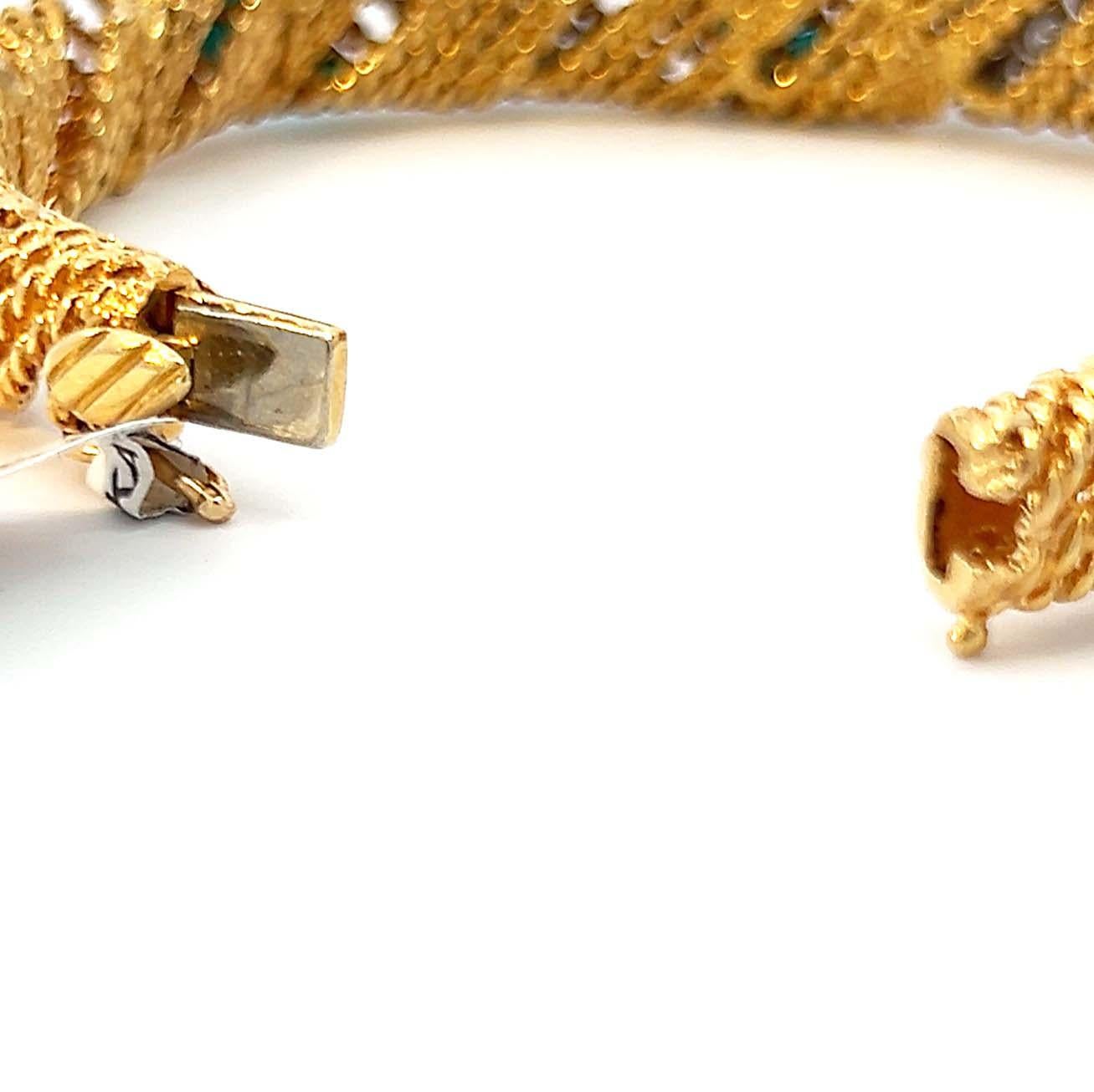 18-karat yellow gold vintage 1960s retro diamond and turquoise bracelet cuff. The twist/barber-pole design showcases diamonds and turquoise alternating on each link. Delicately set in the gold twists rows of bright white diamonds and cabochon