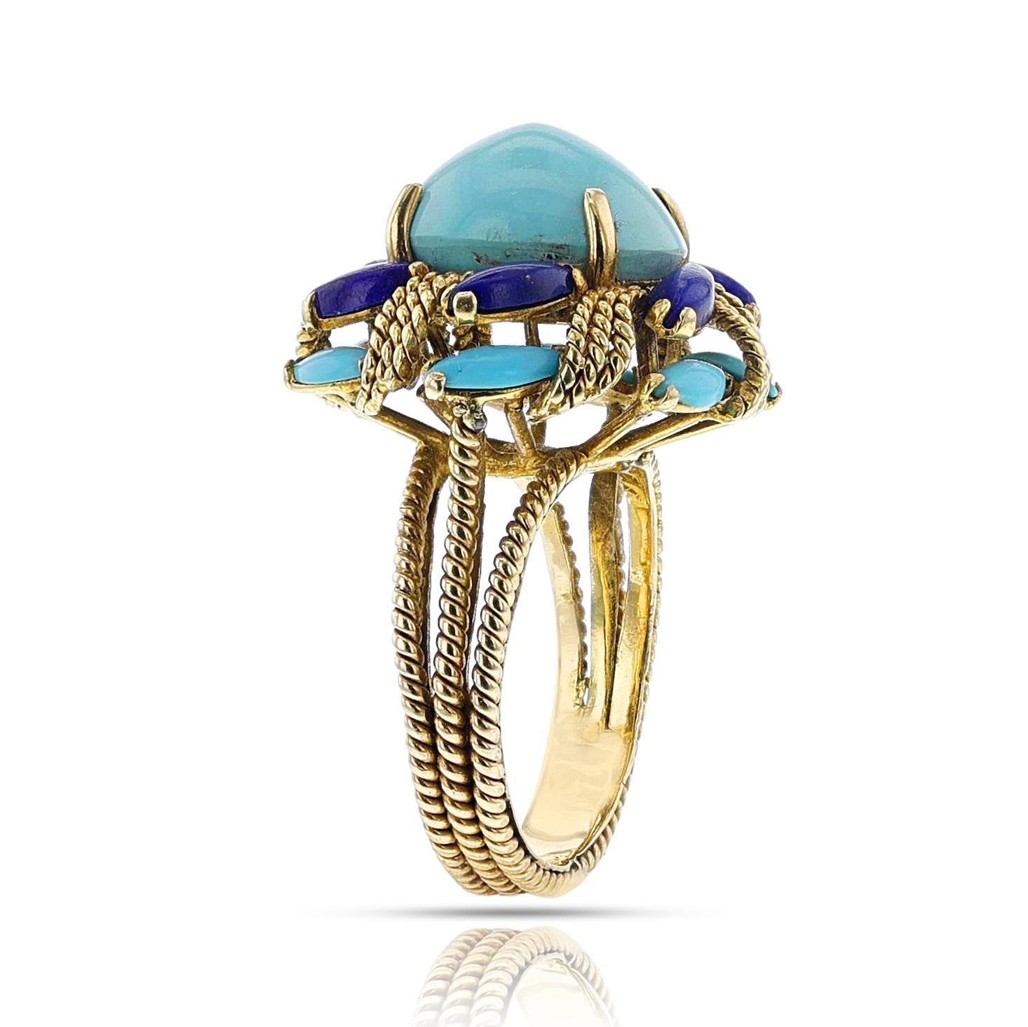A Vintage Turquoise and Lapis Lazuli Cocktail Ring made in 14k yellow gold. The center cabochon is 6.5 carats. The marquise turquoises weigh appx. 1 carats. The marquise cabochon lapis lazuli weigh appx. 1 carats. The ring weighs 8.13 grams. The