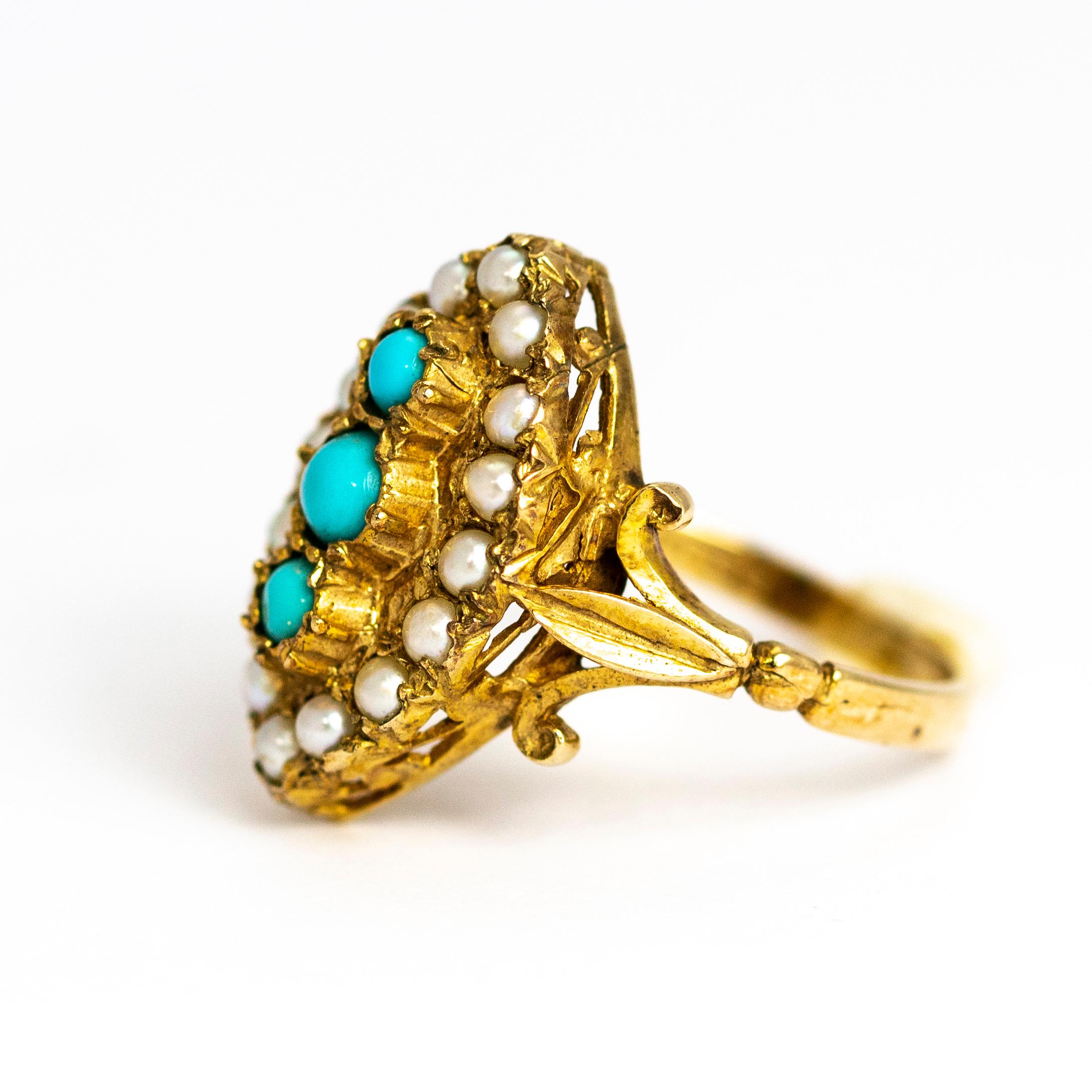 This amazing navette shaped ring holds three turquoise stones which is surrounded by smaller pearls set in a wonderful textured setting. The shoulders have beautiful scroll detail and the main stone setting has open work detail. All modelled out of