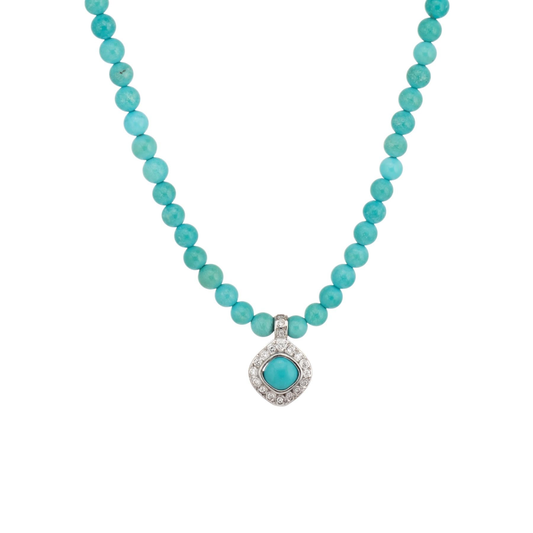 Finely detailed vintage turquoise bead necklace with a diamond drop, crafted in 14 karat white gold (pendant) and 14 karat white gold (clasp).  

4mm turquoise beads are strung onto the necklace. The beads are uniform in size. The pendant drop is