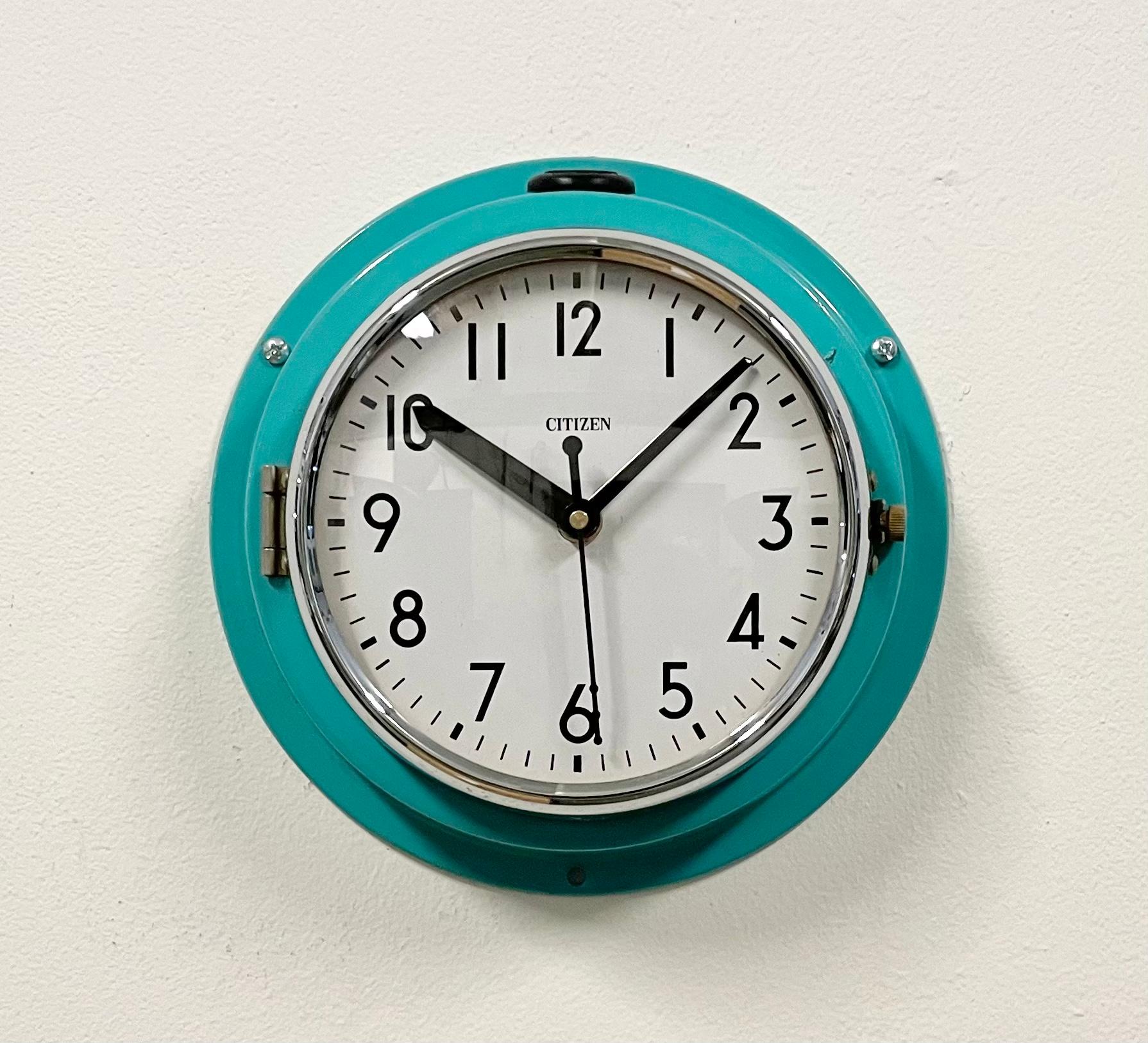 Vintage Citizen navy slave clock designed during the 1970s and produced till 1990s. These clocks were used on large Japanese tankers and cargo ships. It features a turquoise metal frame, a plastic dial and curved clear glass cover. This item has