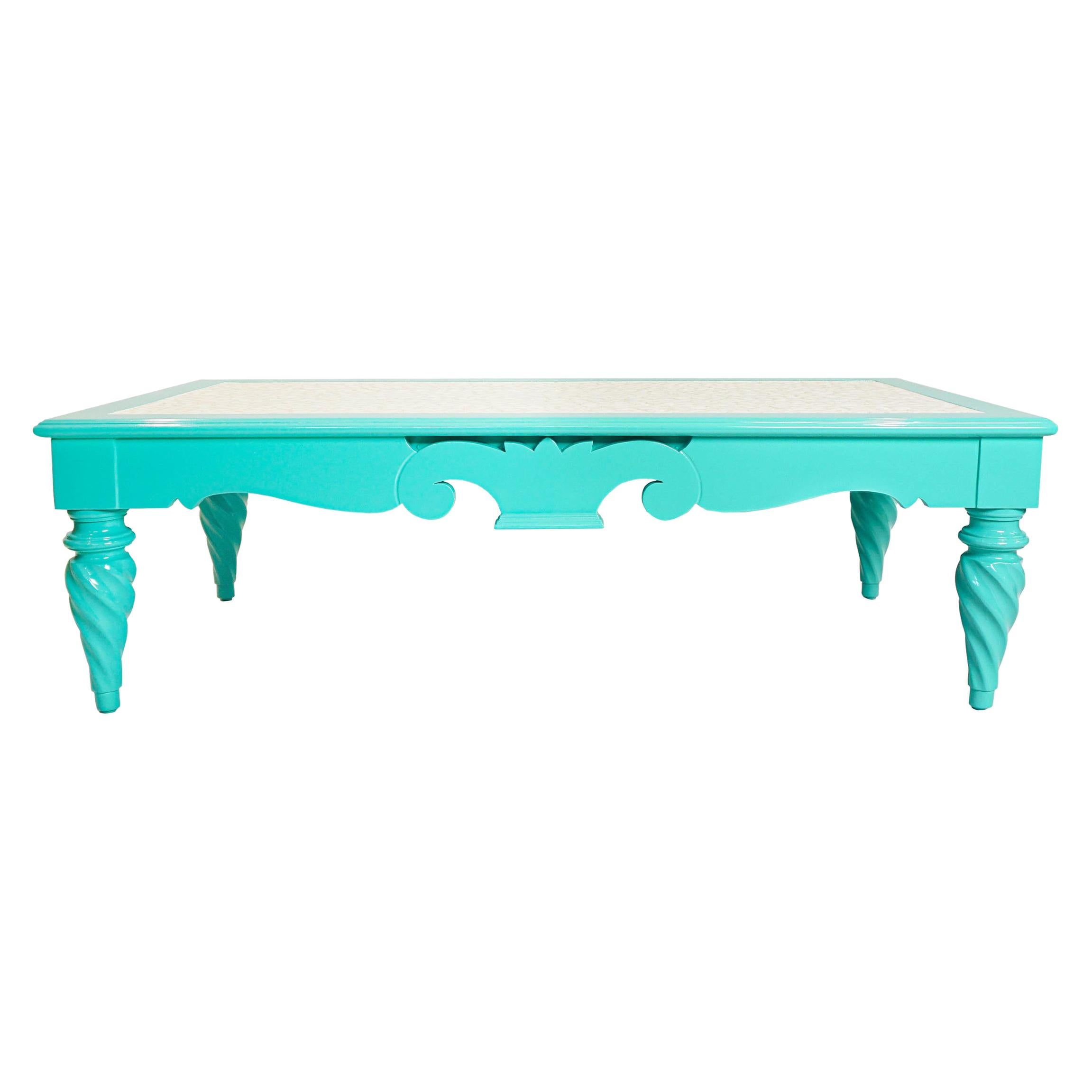 One-of-a-kind hard maple vintage coffee table reimagined. Lacquered in turquoise and topped in an inlaid mother-of-pearl paper with a protective finish. 

Measurements:
Overall: 48”W x 24”D x 15”H