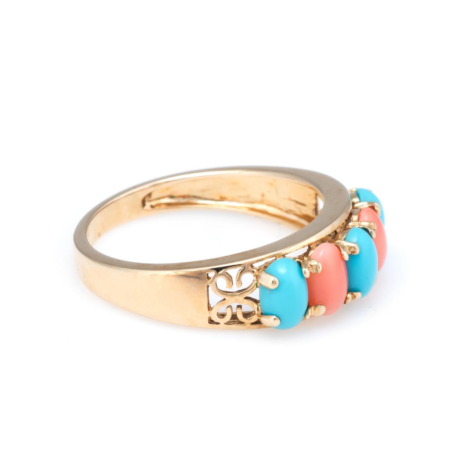 Elegant vintage turquoise & coral ring, crafted in 14 karat yellow gold. 

Cabochon cut turquoise and coral each measure 6mm x 4mm (estimated at 0.50 carats each - 2.50 carats total estimated weight). The turquoise & coral is in excellent condition
