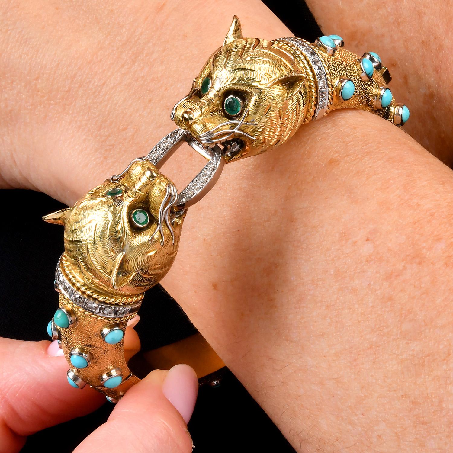 This striking vintage panther head bangle bracelet is crafted in 14K yellow gold, featuring a bold and elegant design.

The bracelet showcases 39 blue turquoise beads adorning the bangle's surface and eyes are set with genuine emeralds adding a